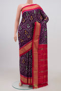 Purple Pochampally Silk Saree with Ikat Print on the body and Zari Border.  displayed on a mannequin