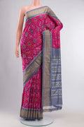 Pink Pochampally Silk Saree with Pure Ikat on the body and Zari Border displayed on a mannequin
