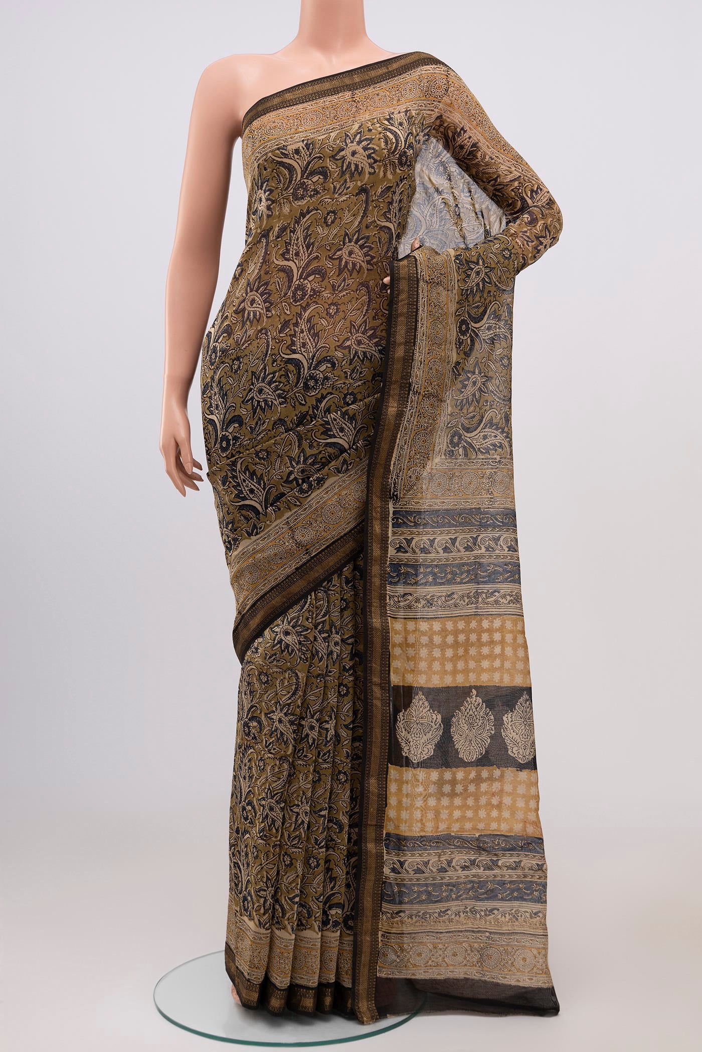 Mehandi Green Maheshwari Silk Cotton Saree with Printed design on the body and Zari Border.  displayed on a mannequin