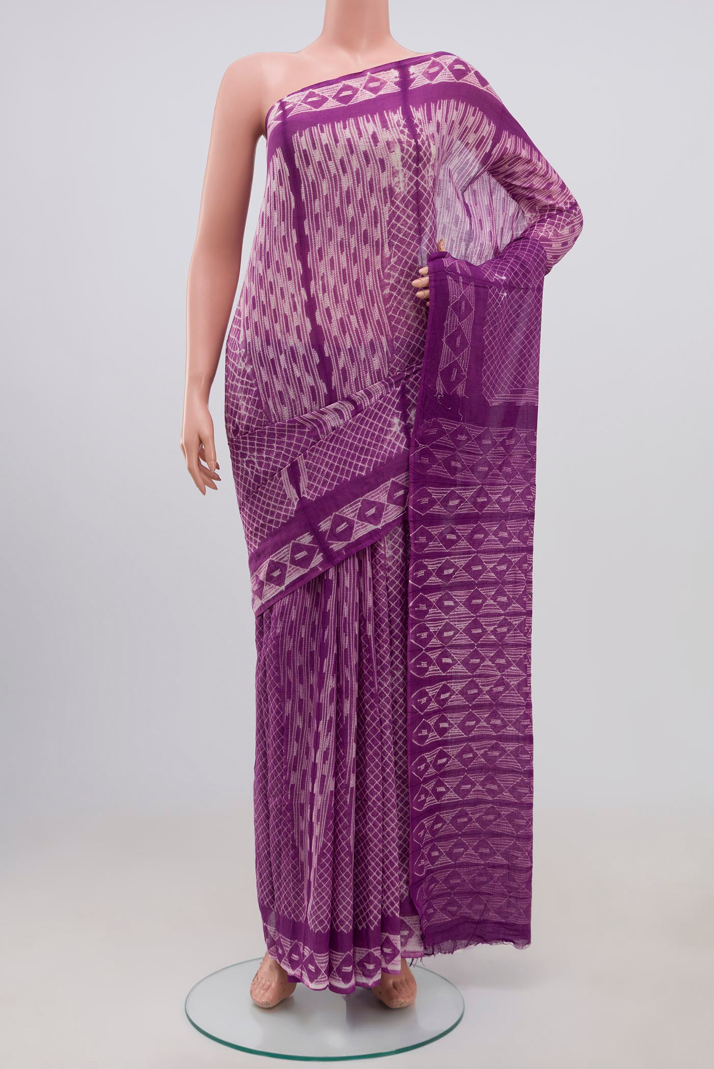Lavender Printed Cotton Saree with Printed design on the body and Printed Border.  displayed on a mannequin