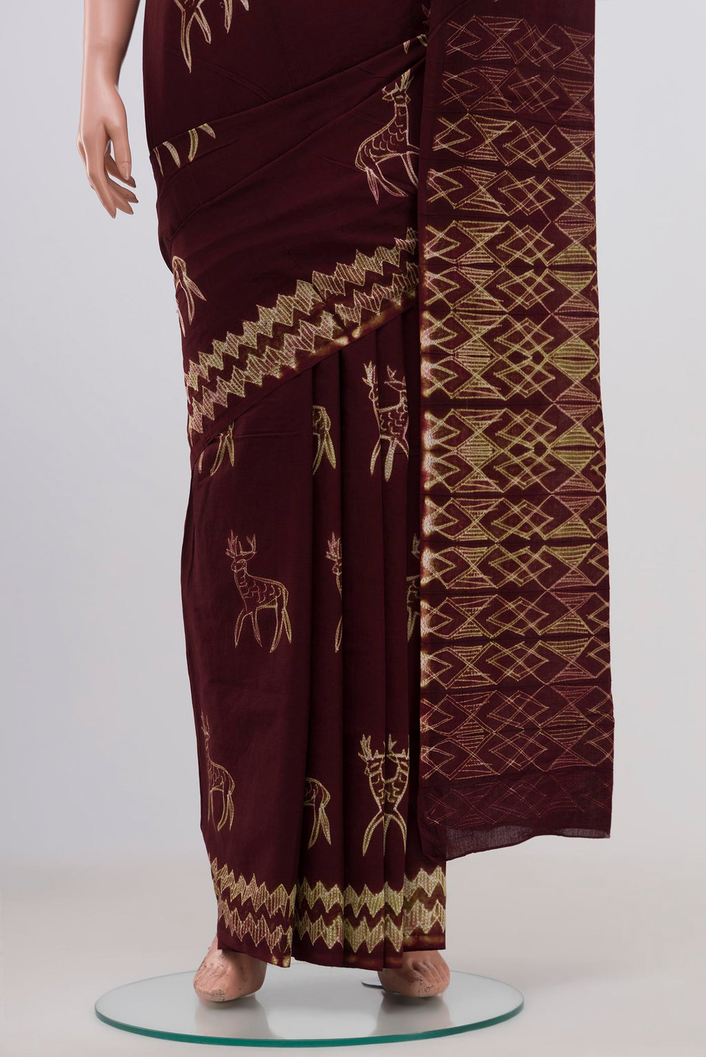 Pleats and pallu of Brown Printed Cotton Saree with Printed design on the body and Without Border. 