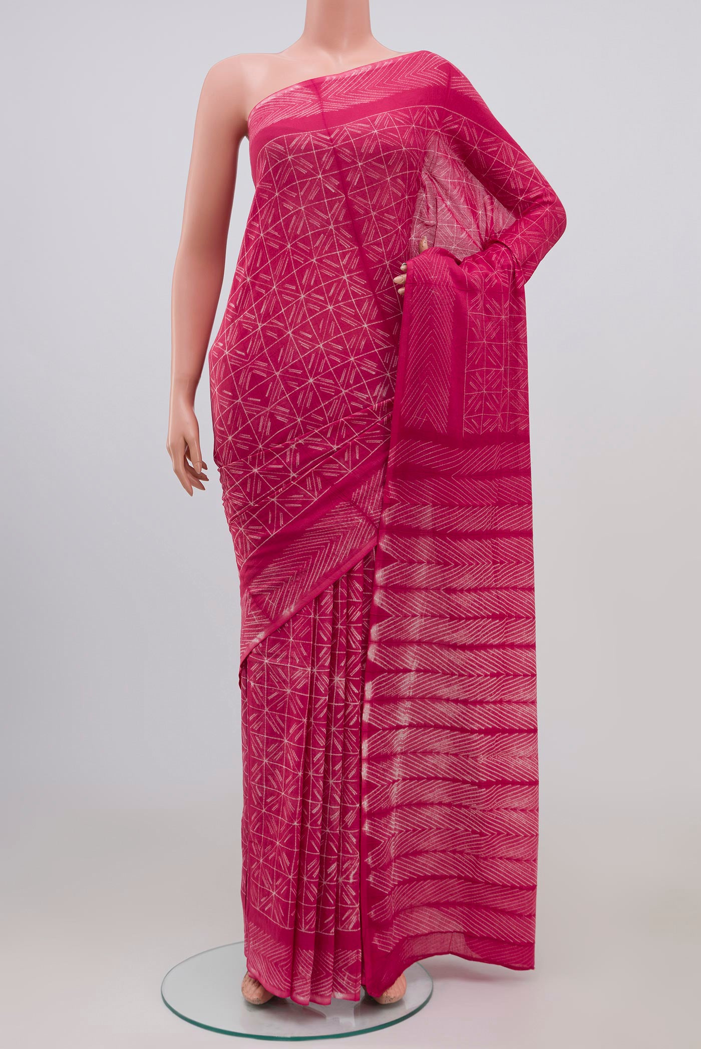 Pink Printed Cotton Saree with Printed design on the body and Printed Border.  displayed on a mannequin
