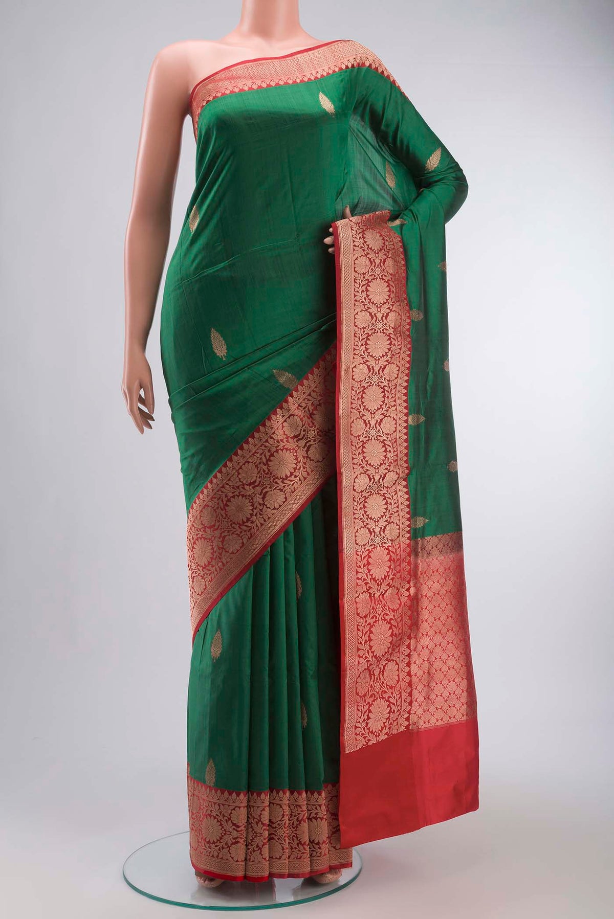 Green Banarasi Katan Silk Saree with Zari Butta on the body and Zari Border displayed on a mannequin