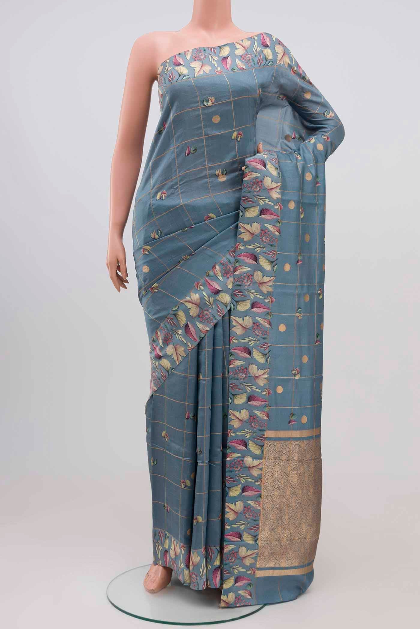 Grey Banarasi Katan Silk Saree with Checked design on the body and Printed Border.  displayed on a mannequin