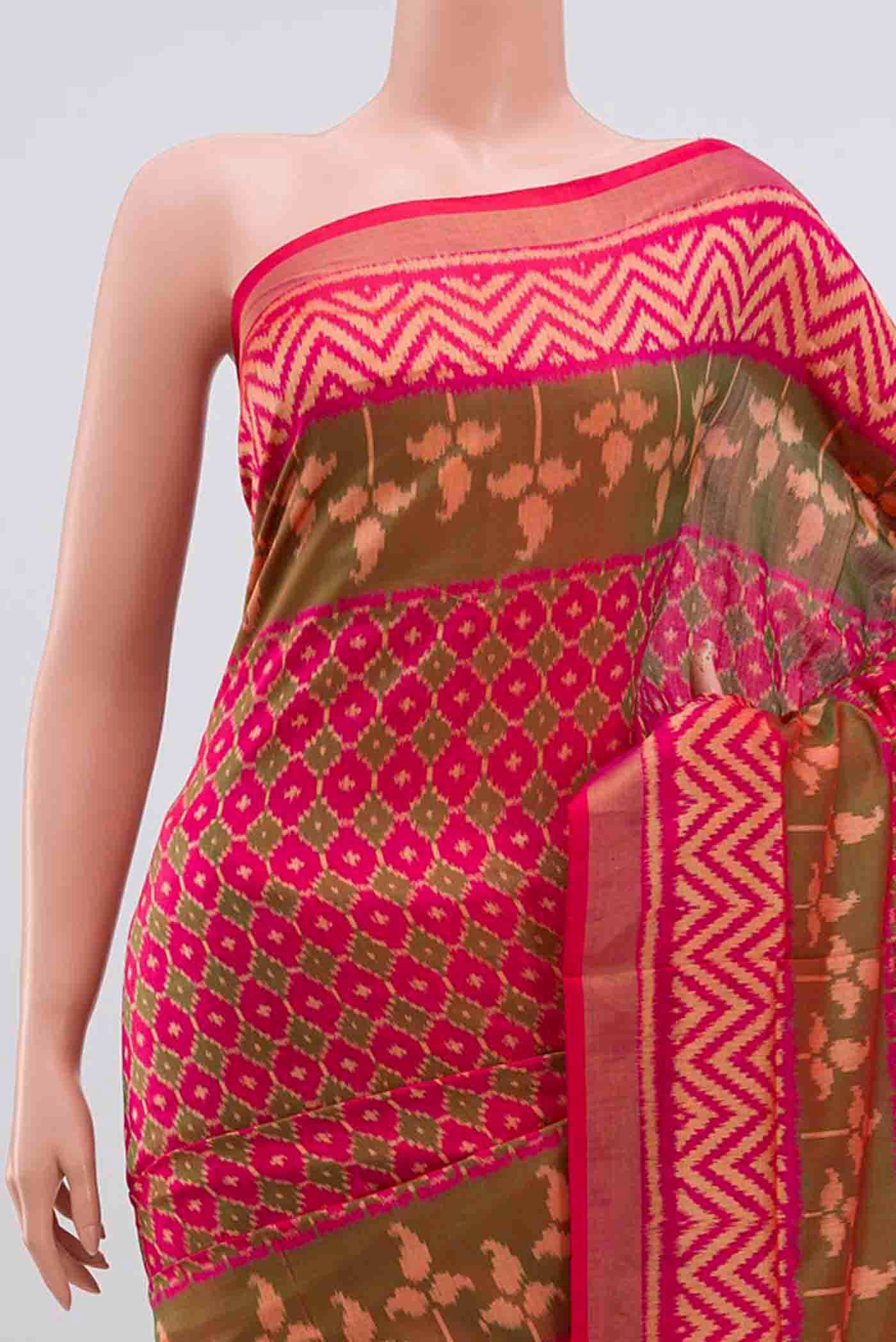 Border image of Dark Pink Rajkot Patola Silk Saree with Ikat design on the body and Zari Border. 