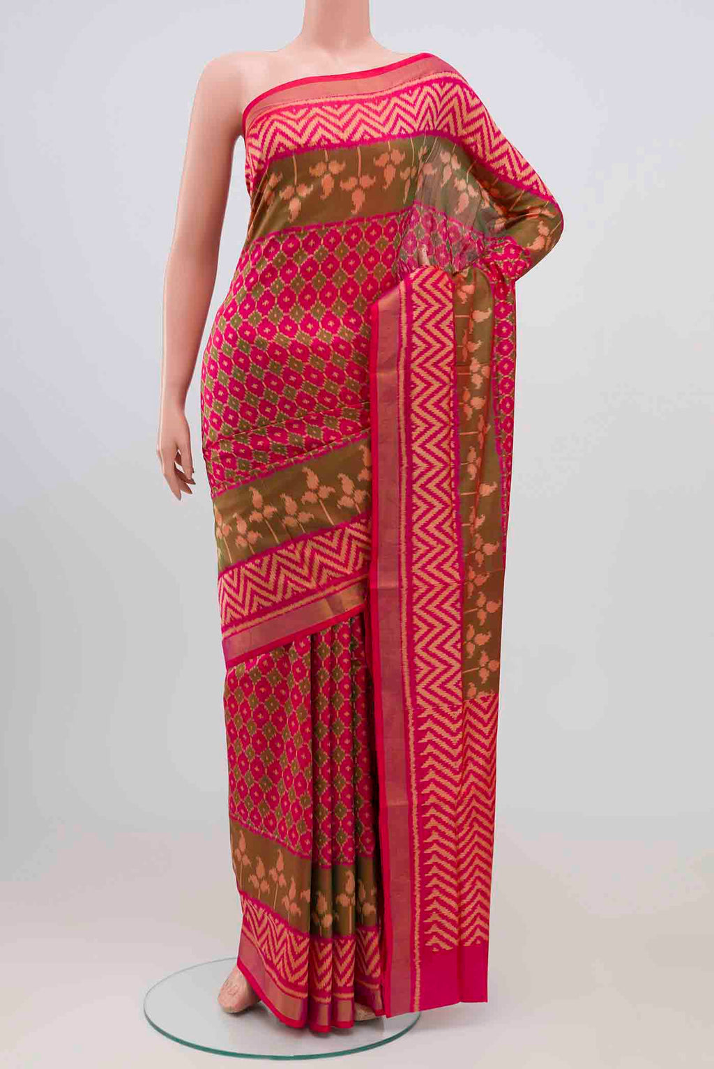Dark Pink Rajkot Patola Silk Saree with Ikat design on the body and Zari Border.  displayed on a mannequin
