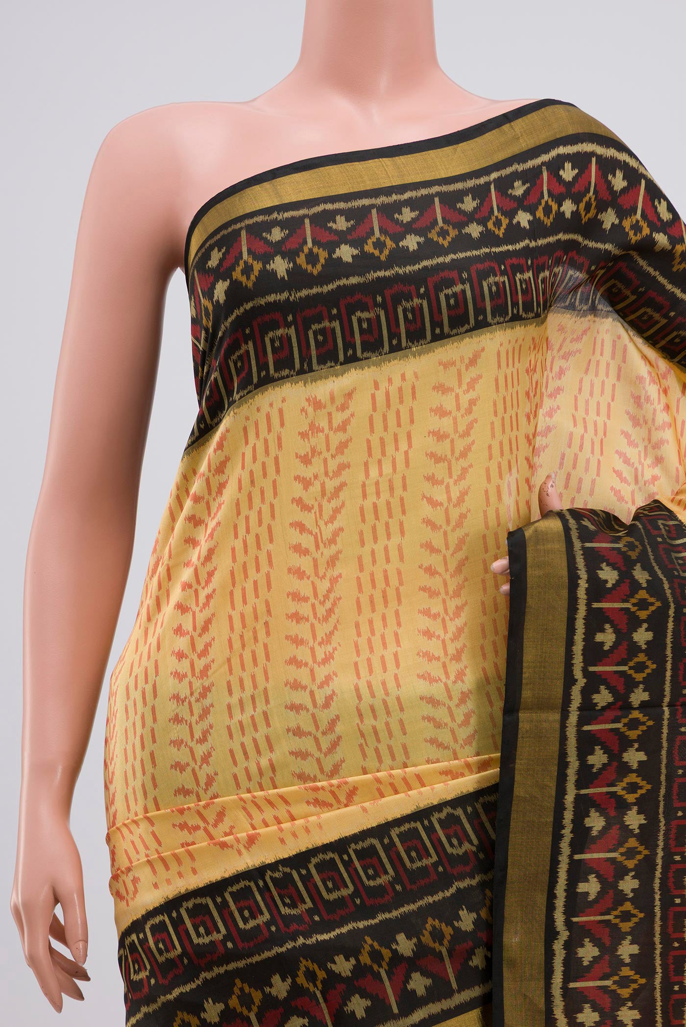 Border image of Cream Rajkot Patola Silk Saree with Ikat Print on the body and Ikat Border. 