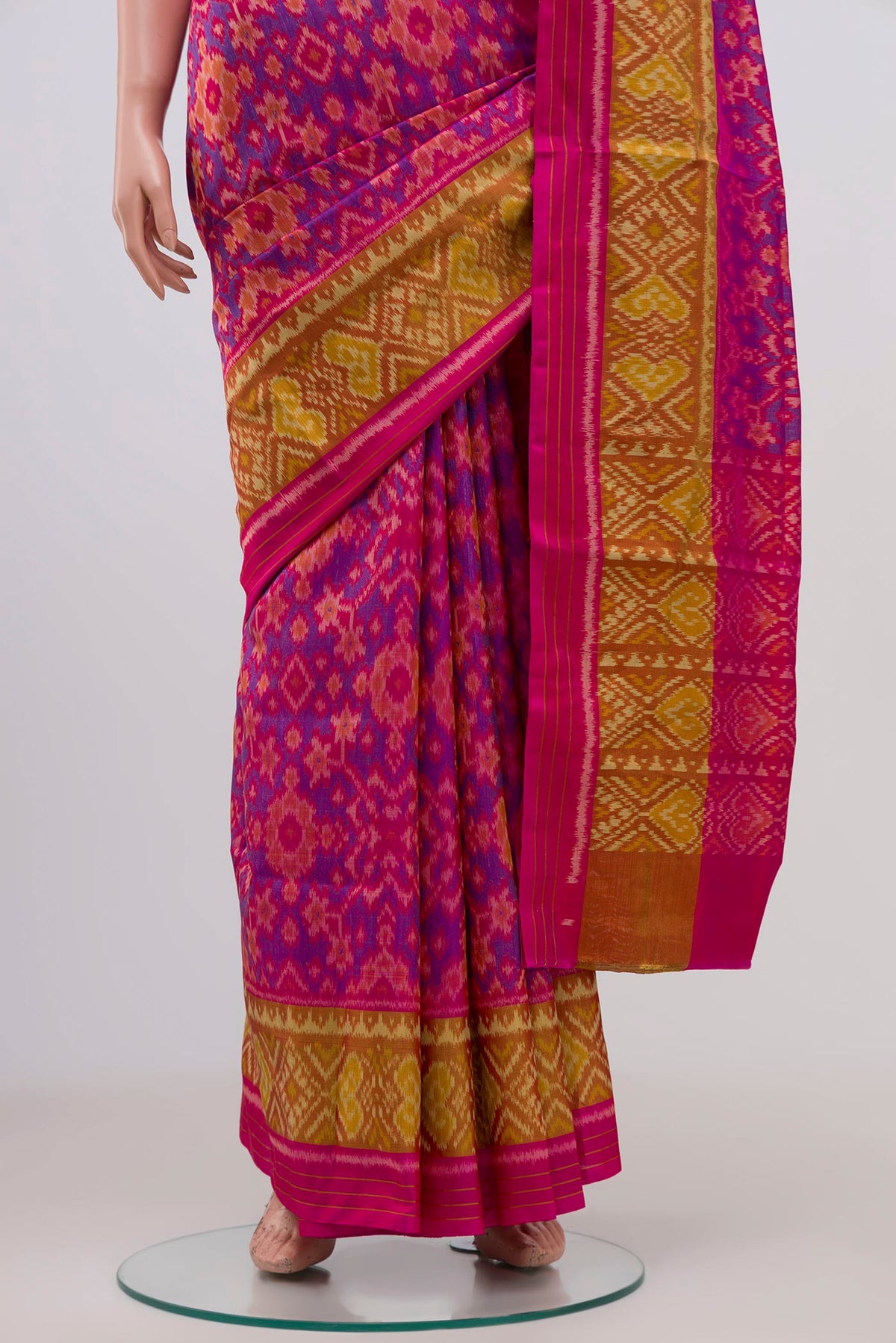 Pleats and pallu of Pink Rajkot Patola Silk Saree with Ikat Print on the body and Ikat Border. 