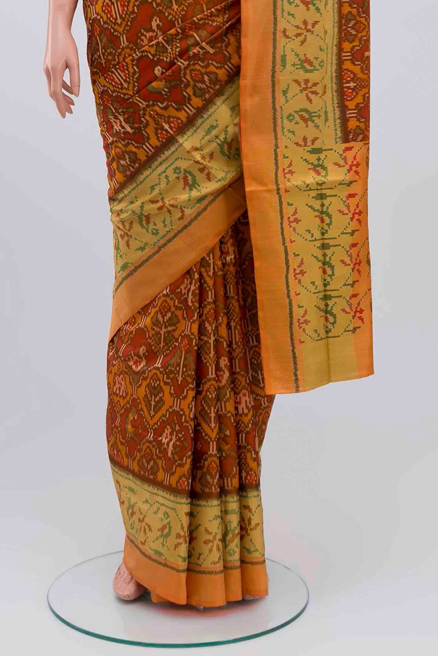 Pleats and pallu of Rust Rajkot Patola Silk Saree with Pure Ikat on the body and Zari Border