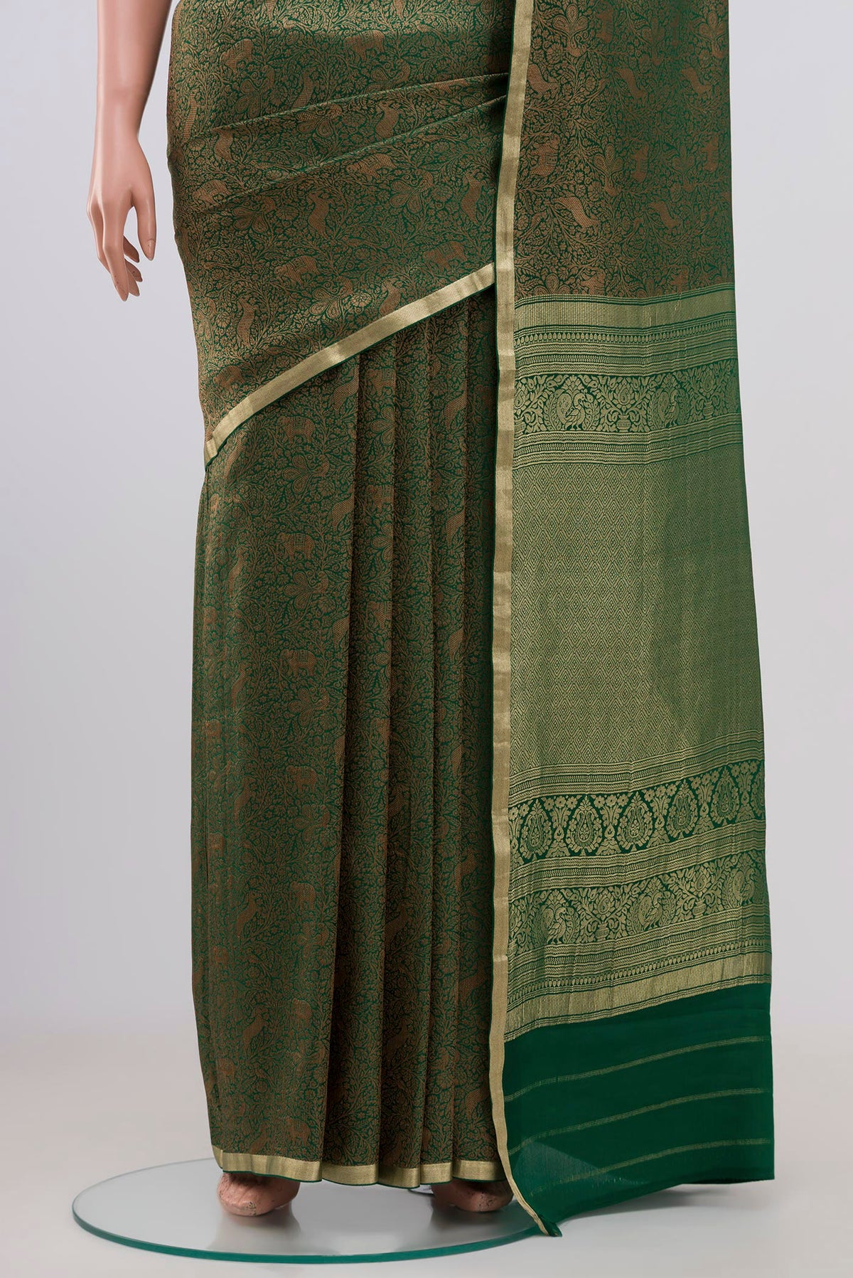 Pleats and pallu of Green Mysore Crepe Saree with Zari Brocade on the body and Fancy Border. 