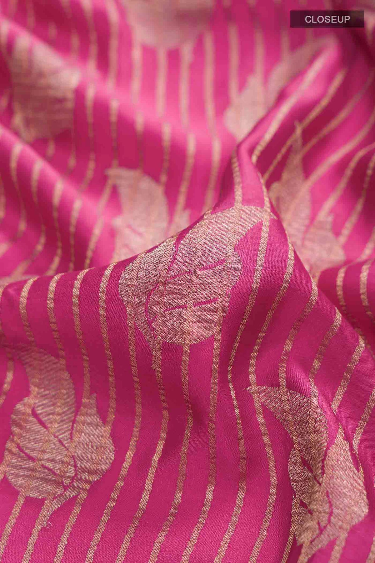 Close up of Pink Mysore Crepe Saree with Zari Butta on the body and Zari Border displaying folds