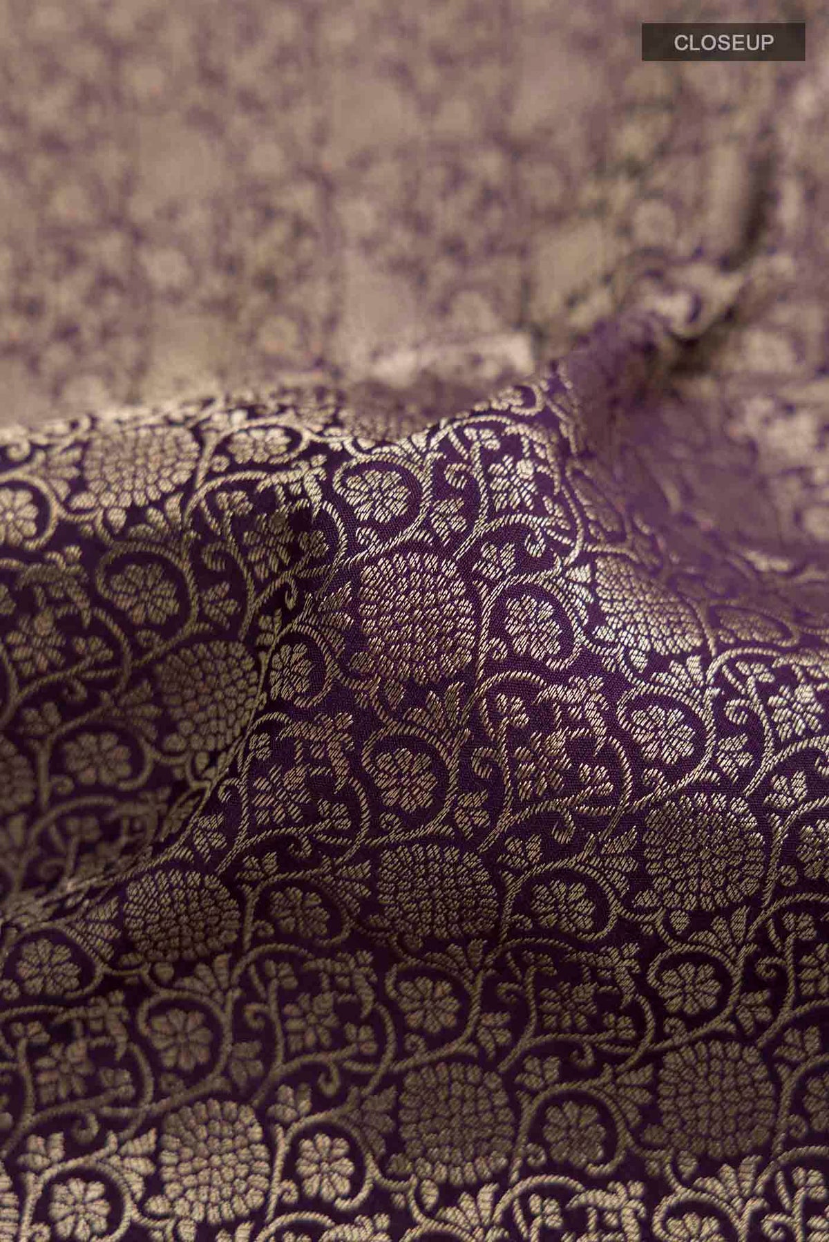 Close up of Navy Blue Mysore Crepe Saree with Zari Brocade on the body and Zari Border displaying folds