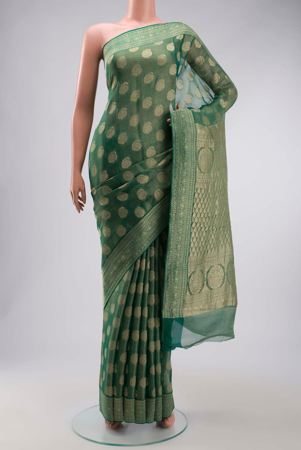 Green Banarasi Georgette Saree with Zari Butta on the body and Zari Border displayed on a mannequin