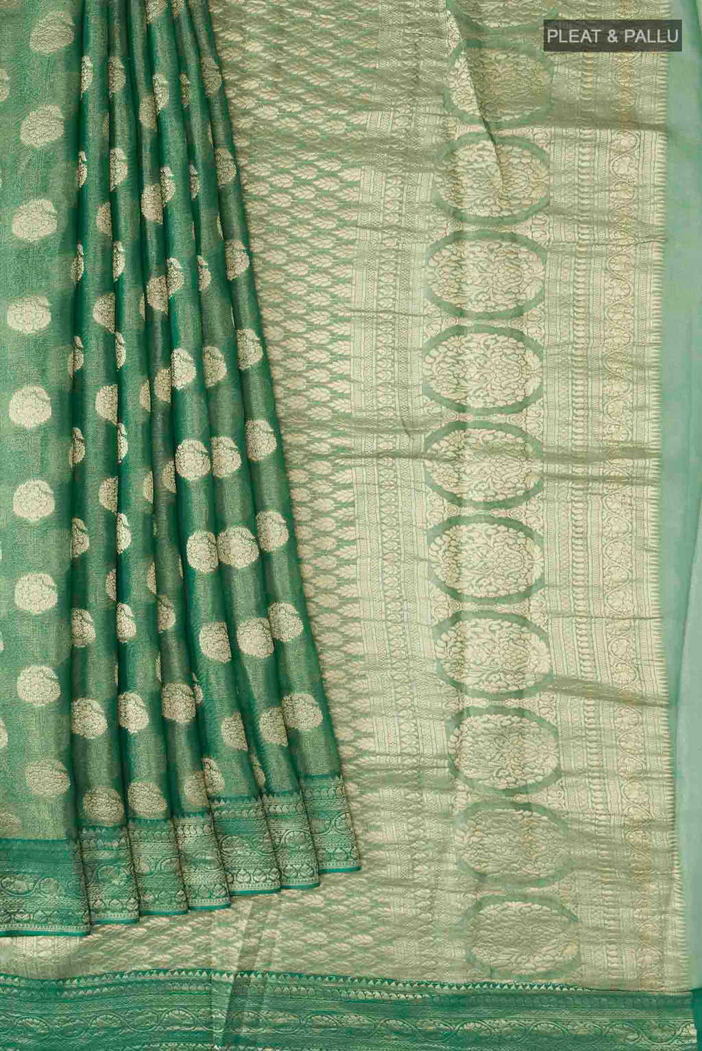 Pleats and pallu of Green Banarasi Georgette Saree with Zari Butta on the body and Zari Border