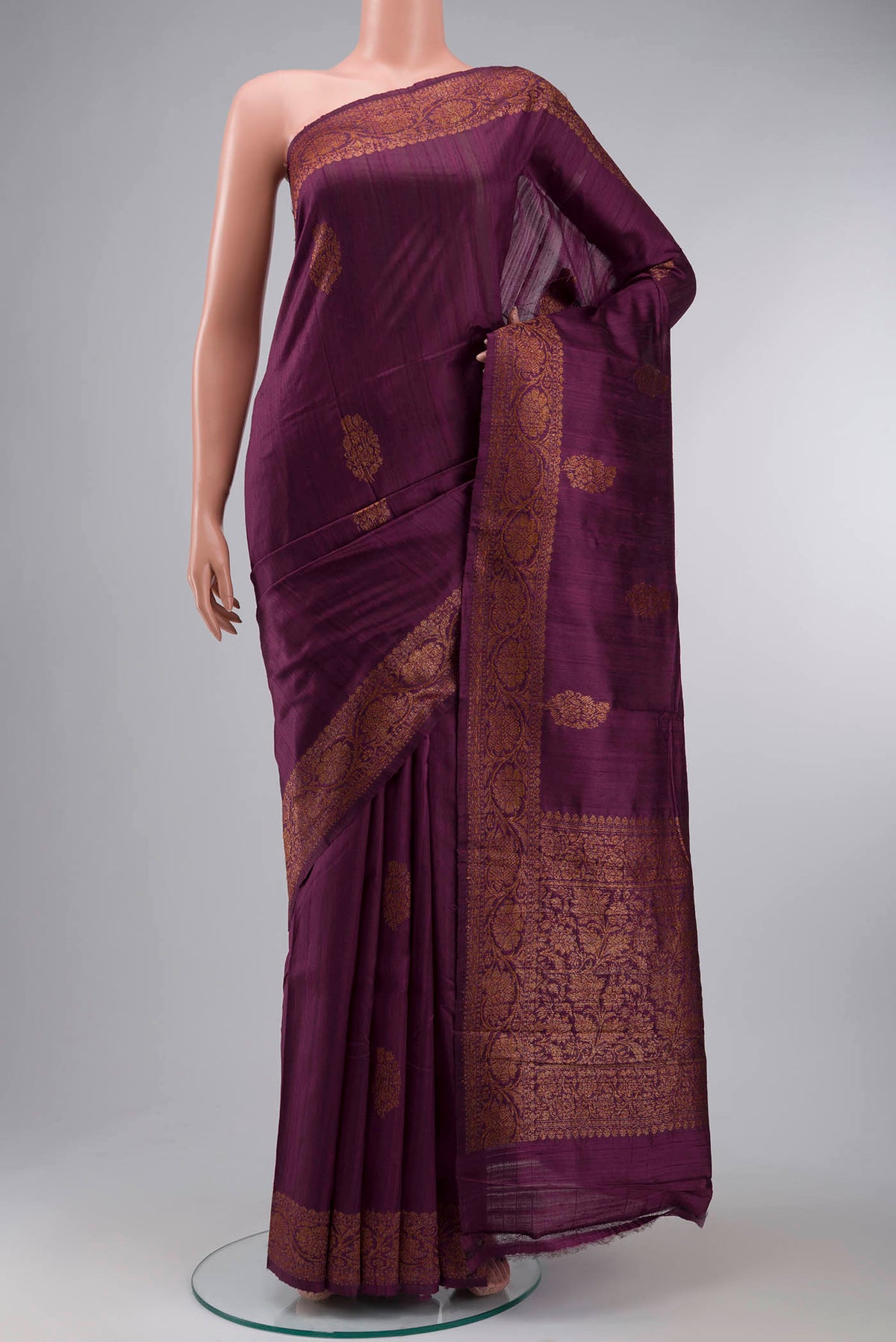 Burgundy Banarasi Tussar Silk Saree with Zari Butta on the body and Zari Border displayed on a mannequin