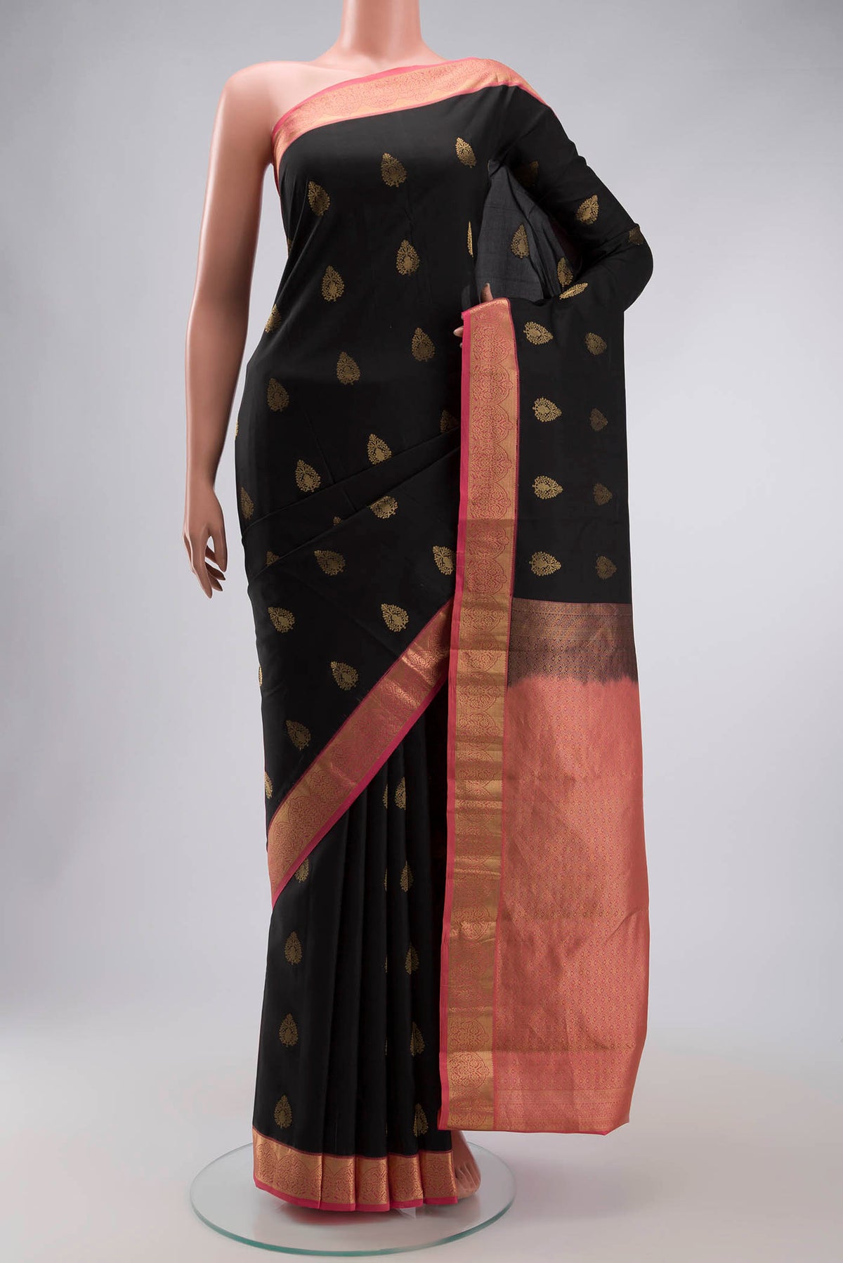 Black Kanchipuram Silk Saree with Zari Butta on the body and Zari Border displayed on a mannequin