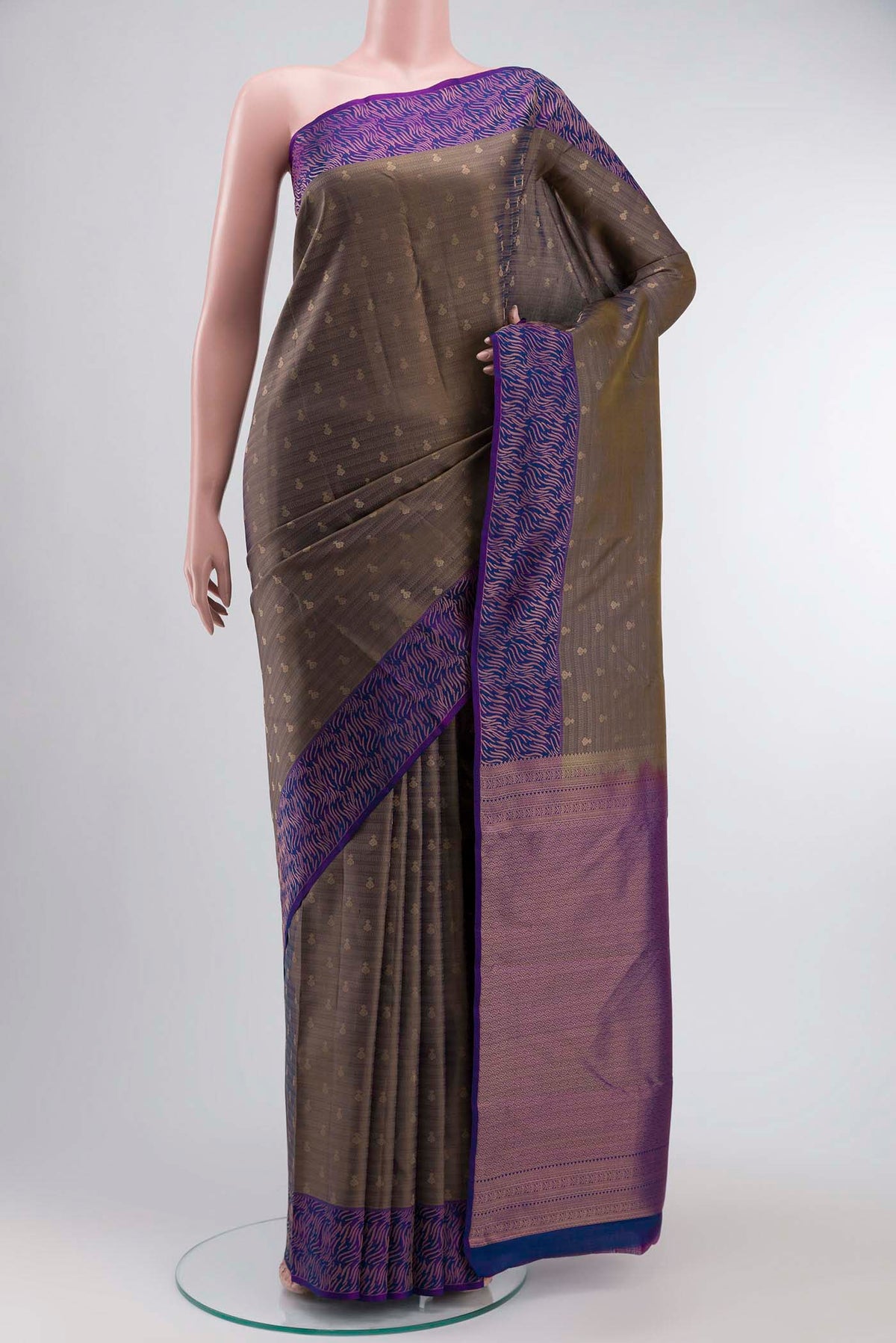 Grey Kanchipuram Silk Saree with Zari Butta on the body and Zari Border displayed on a mannequin