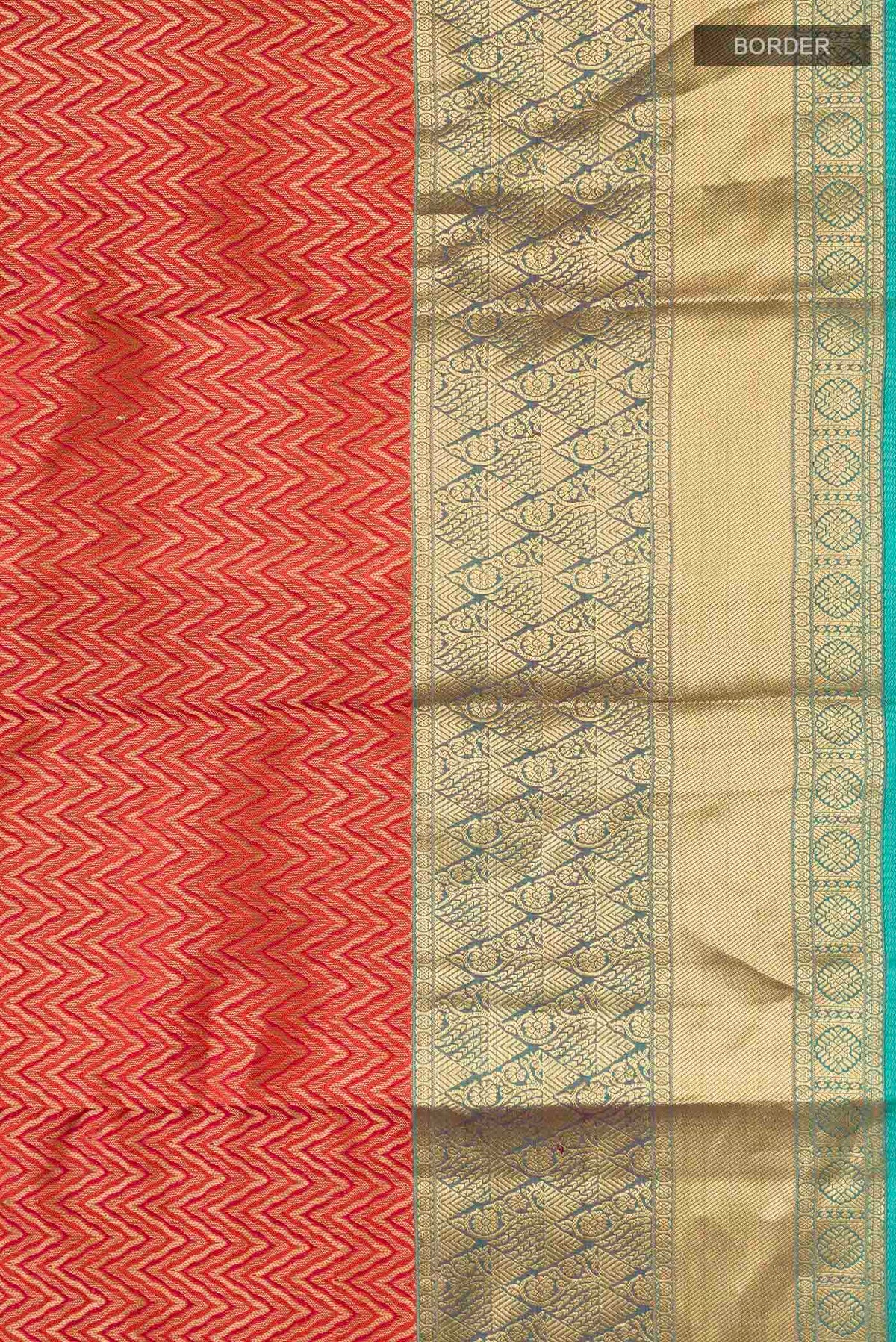 Border image of Rust Kanchipuram Silk Saree with Zari Brocade on the body and Zari Border