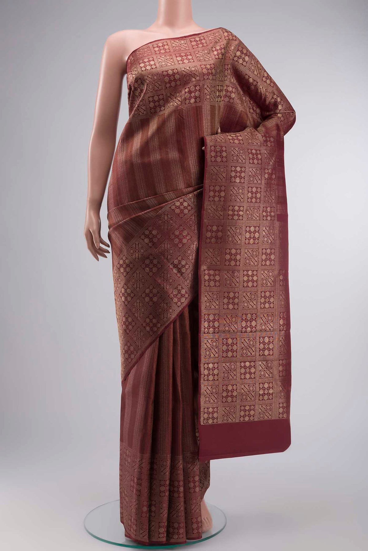 Maroon Kanchipuram Silk Saree with Zari Brocade on the body and Zari Border displayed on a mannequin
