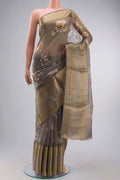 Grey Organza Silk Saree with Printed design on the body and Zari Border displayed on a mannequin
