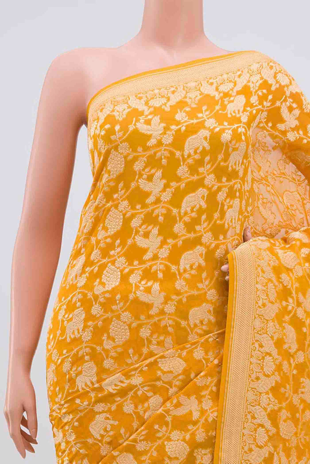 Border image of Yellow Banarasi Georgette Saree with Zari Brocade on the body and Zari Border. 