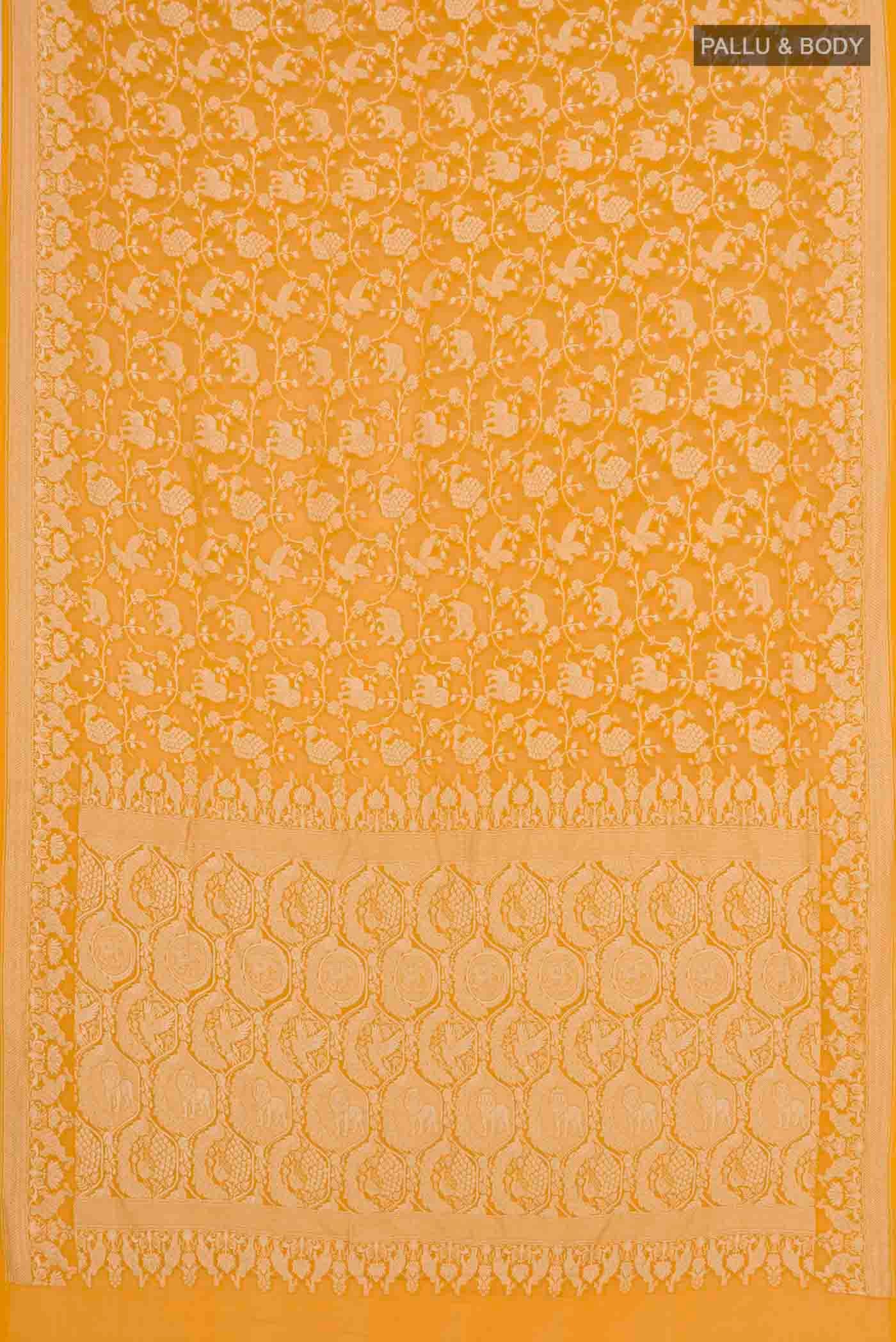 Flat view of Yellow Banarasi Georgette Saree with Zari Brocade on the body and Zari Border. 