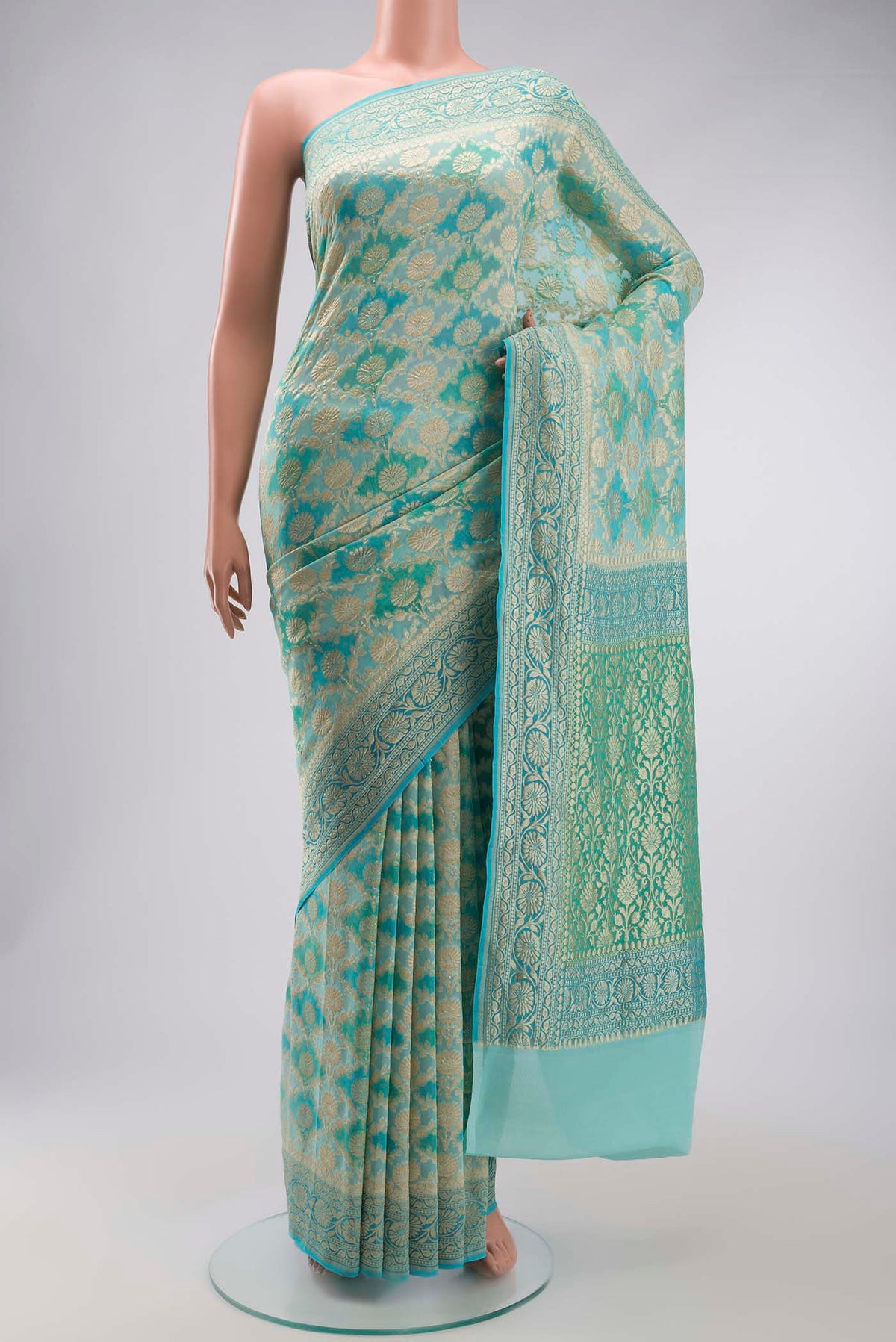 Light Blue Banarasi Georgette Saree with Zari Butta on the body and Zari Border displayed on a mannequin