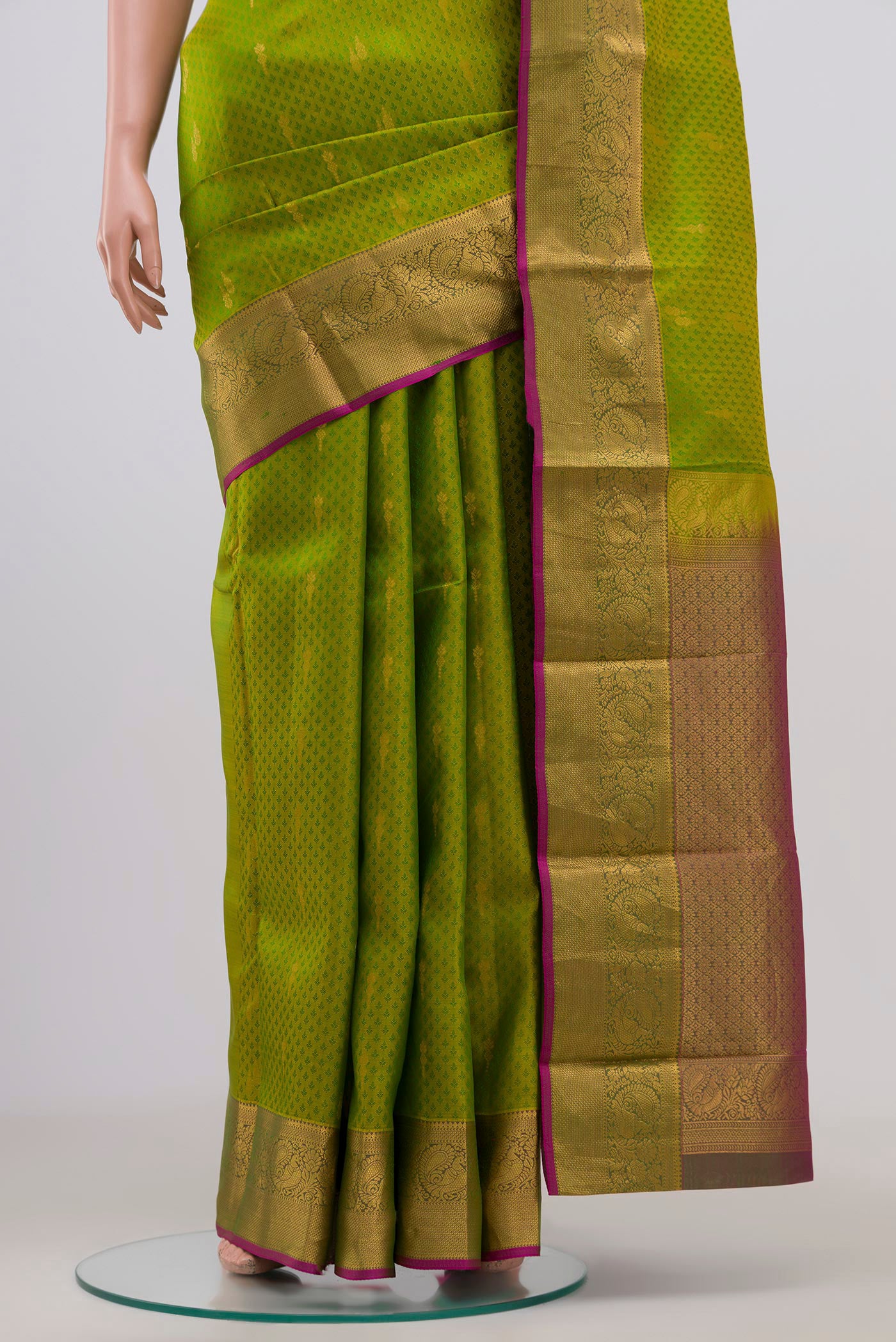 Pleats and pallu of Green Kanchipuram Saree with Jacquard With Zari Butta on the body and Zari Border. 