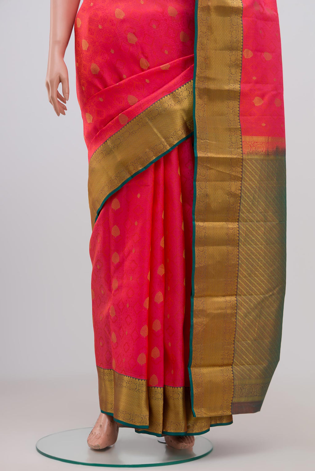Pleats and pallu of Pink Kanchipuram Saree with Jacquard With Zari Butta on the body and Zari Border. 