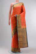 Coral Kanchipuram Silk Saree with Jacquard With Zari Butta on the body and Zari Border displayed on a mannequin