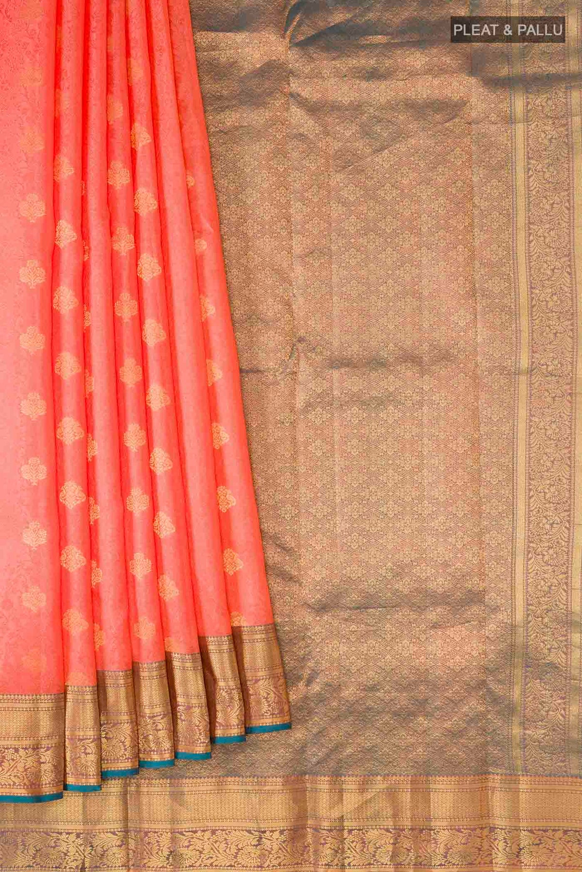Pleats and pallu of Coral Kanchipuram Silk Saree with Jacquard With Zari Butta on the body and Zari Border