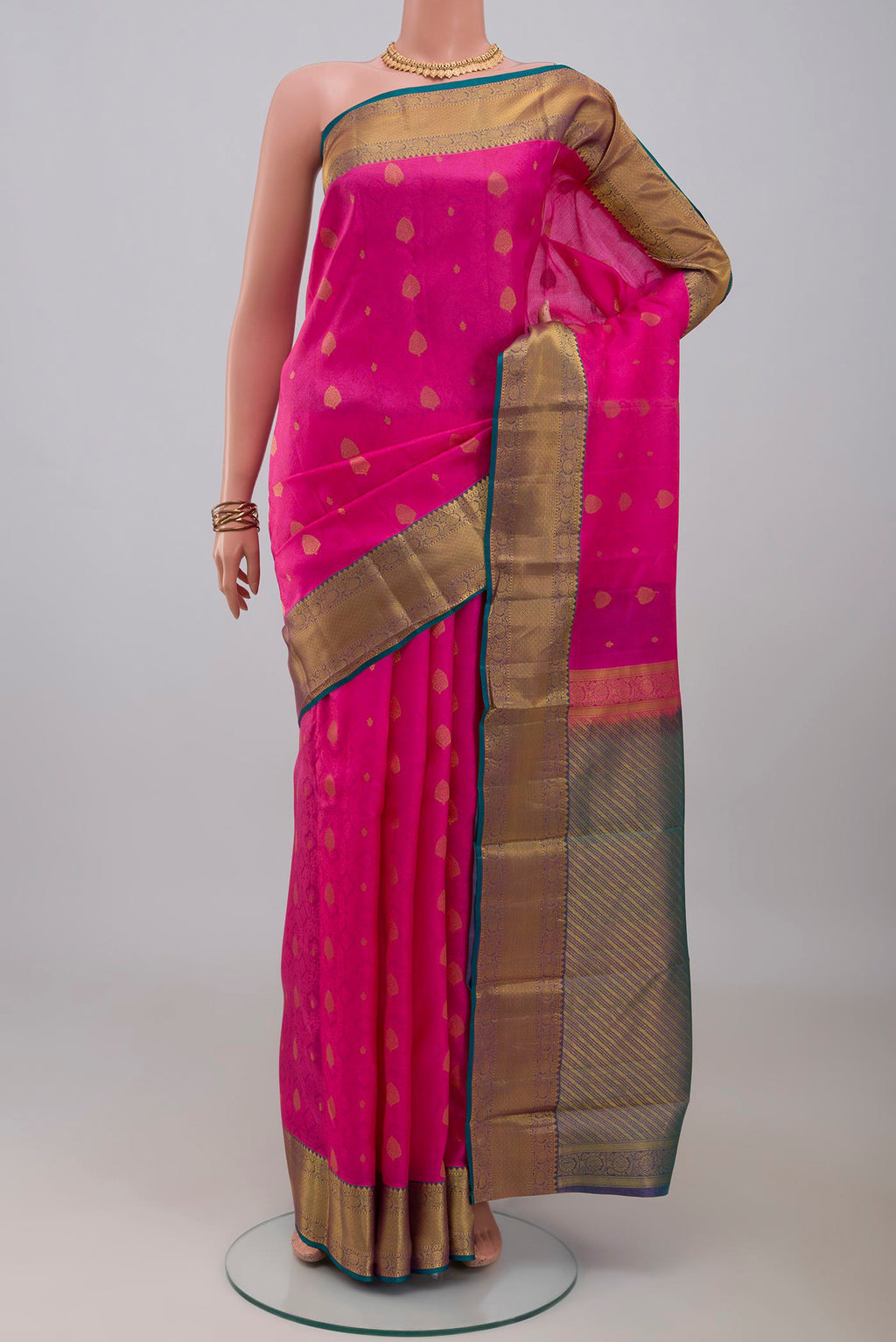 Pink Kanchipuram Silk Saree with Jacquard With Zari Butta on the body and Zari Border.  displayed on a mannequin