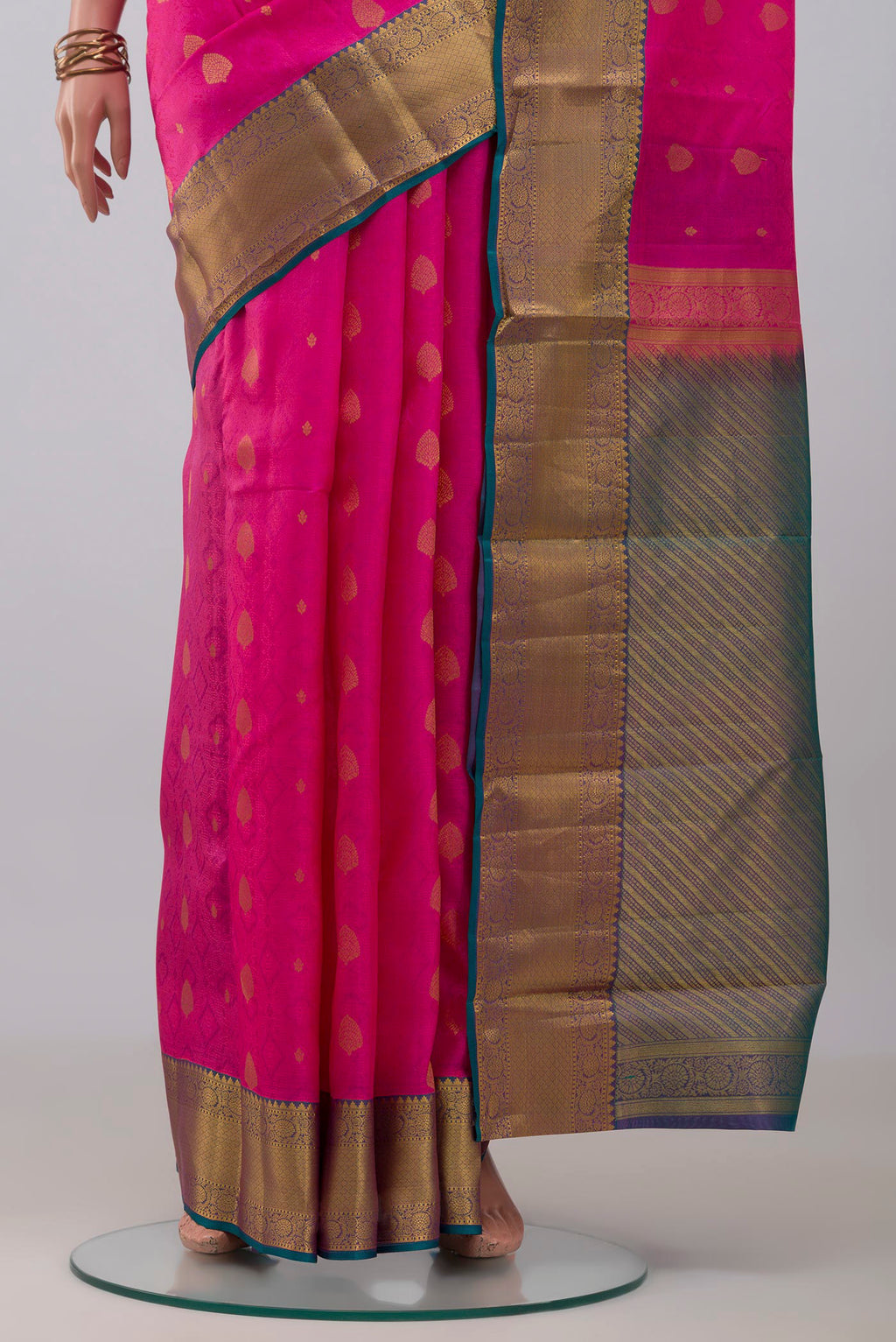 Pleats and pallu of Pink Kanchipuram Silk Saree with Jacquard With Zari Butta on the body and Zari Border. 