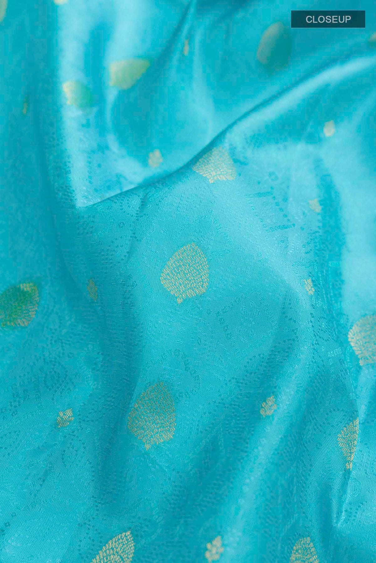 Close up of Blue Kanchipuram Silk Saree with Jacquard With Zari Butta on the body and Zari Border displaying folds