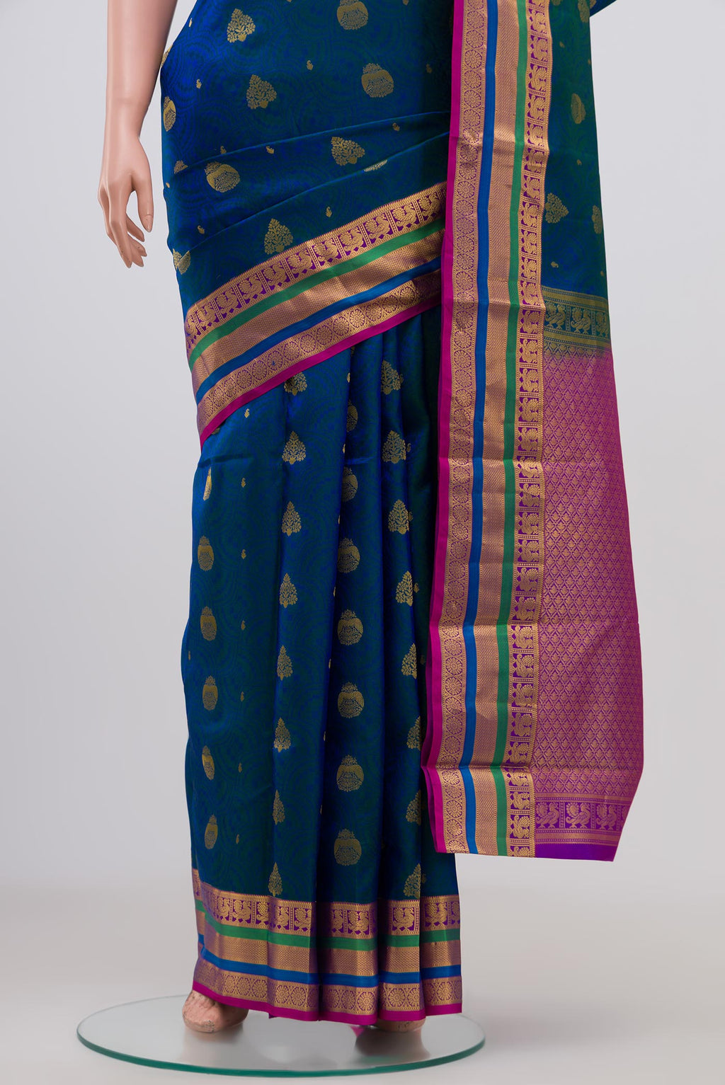 Pleats and pallu of Blue Kanchipuram Silk Saree with Jacquard With Zari Butta on the body and Zari Border. 