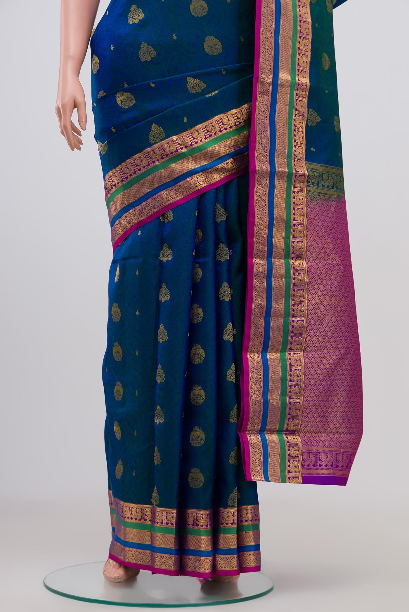 Pleats and pallu of Blue Kanchipuram Silk Saree with Jacquard With Zari Butta on the body and Zari Border. 