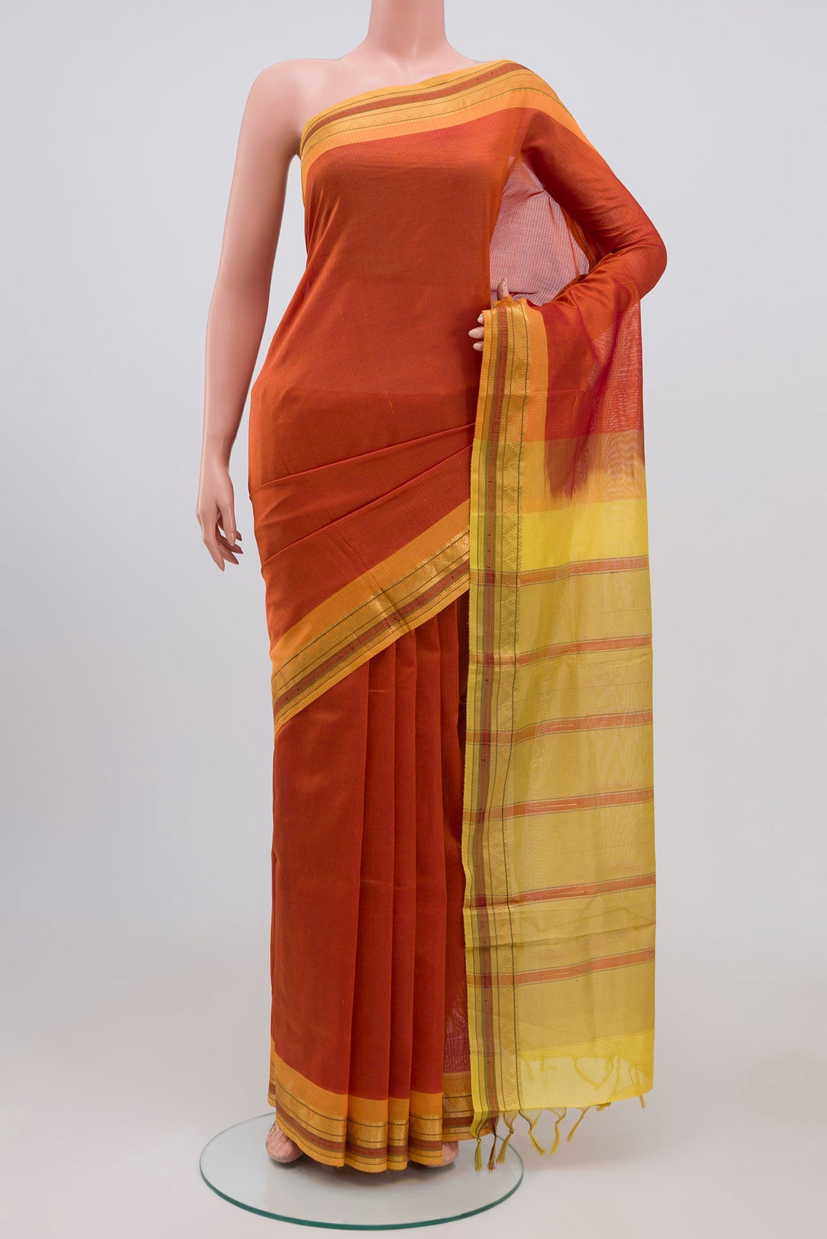 Orange Coimbatore Silk Cotton Saree with Plain Body and Zari Border.  displayed on a mannequin