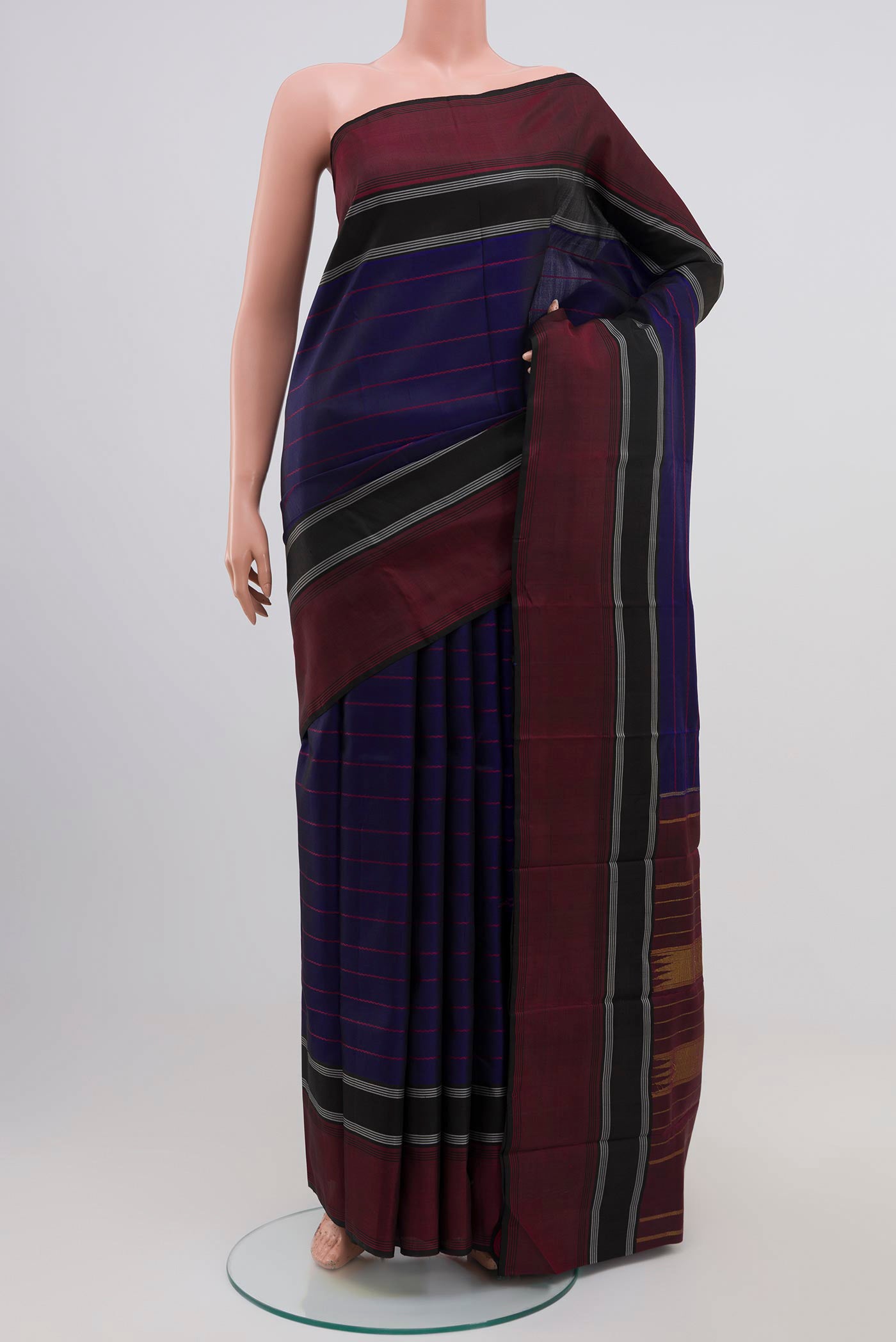 Navy Blue Kanjivaram Silk Saree with Veldhari on the body and Plain Border.  displayed on a mannequin