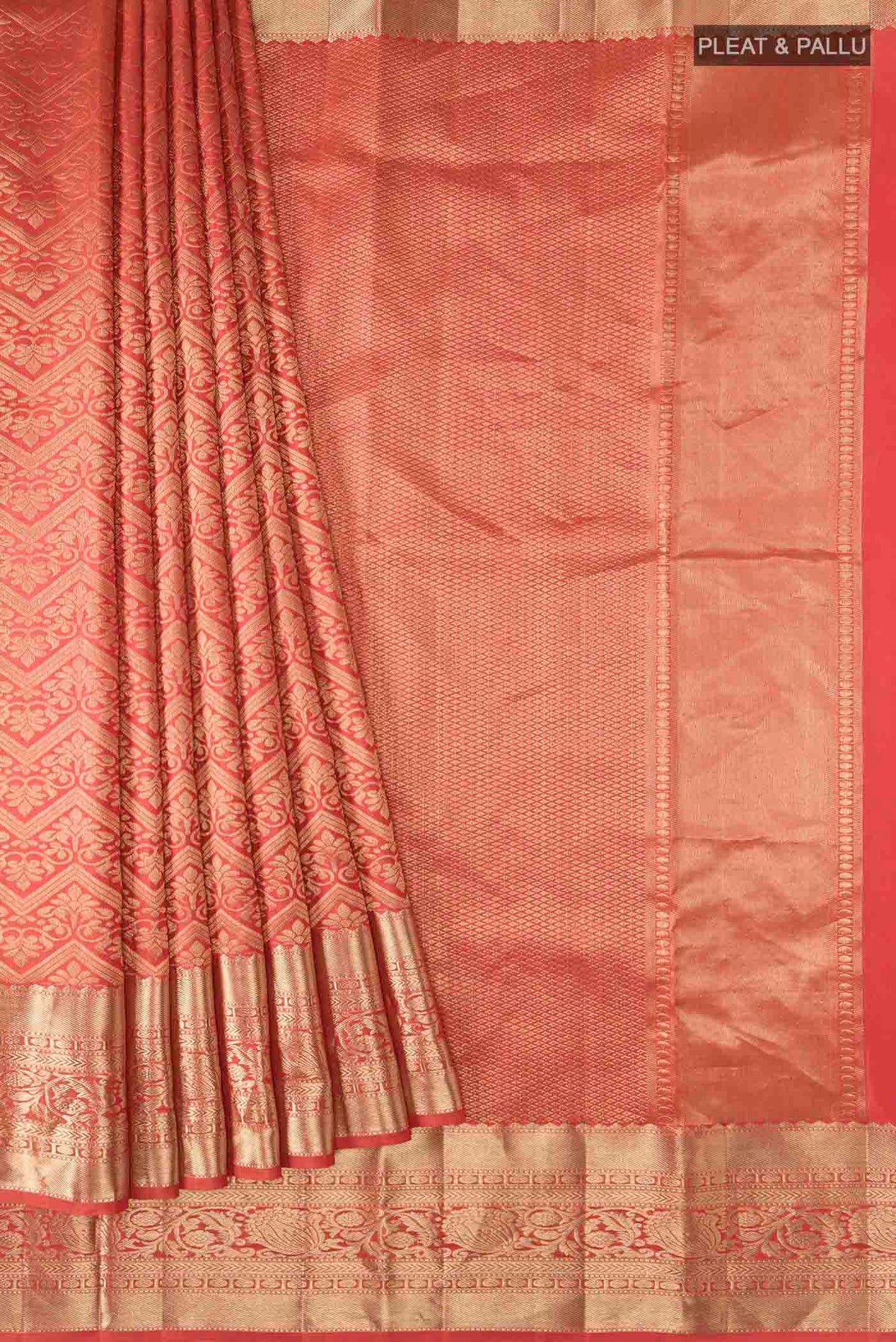 Pleats and pallu of Orange Kanchipuram Silk Saree with Zari Brocade on the body and Zari Border