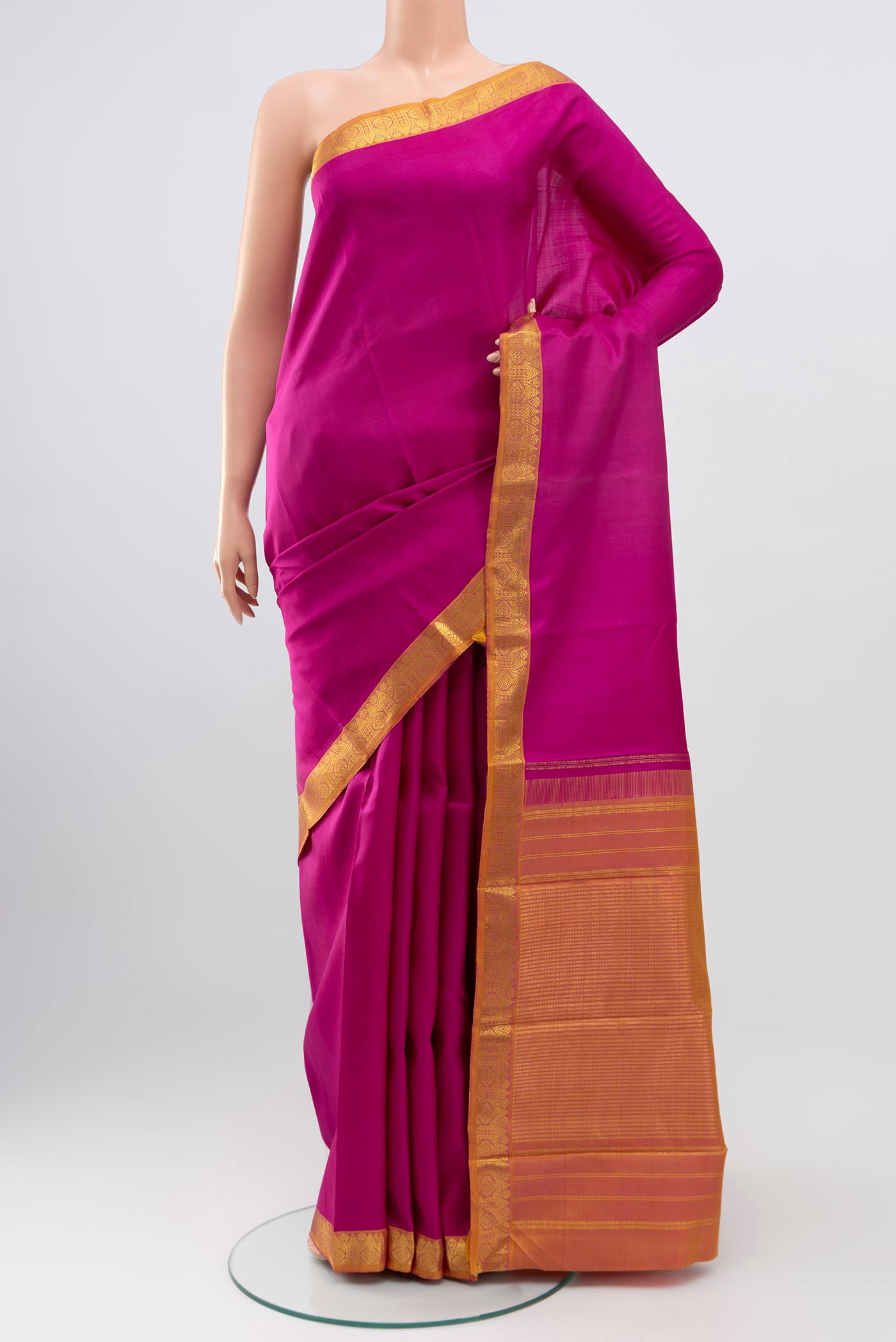 Pure Silk Pure Zari Pink Kanjivaram Saree with Plain Body and Zari Border.  displayed on a mannequin