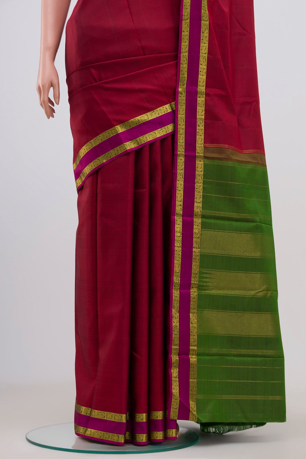 Pleats and pallu of Pure Silk Pure Zari Maroon Kanchipuram Saree with Plain Body and Zari Border. 