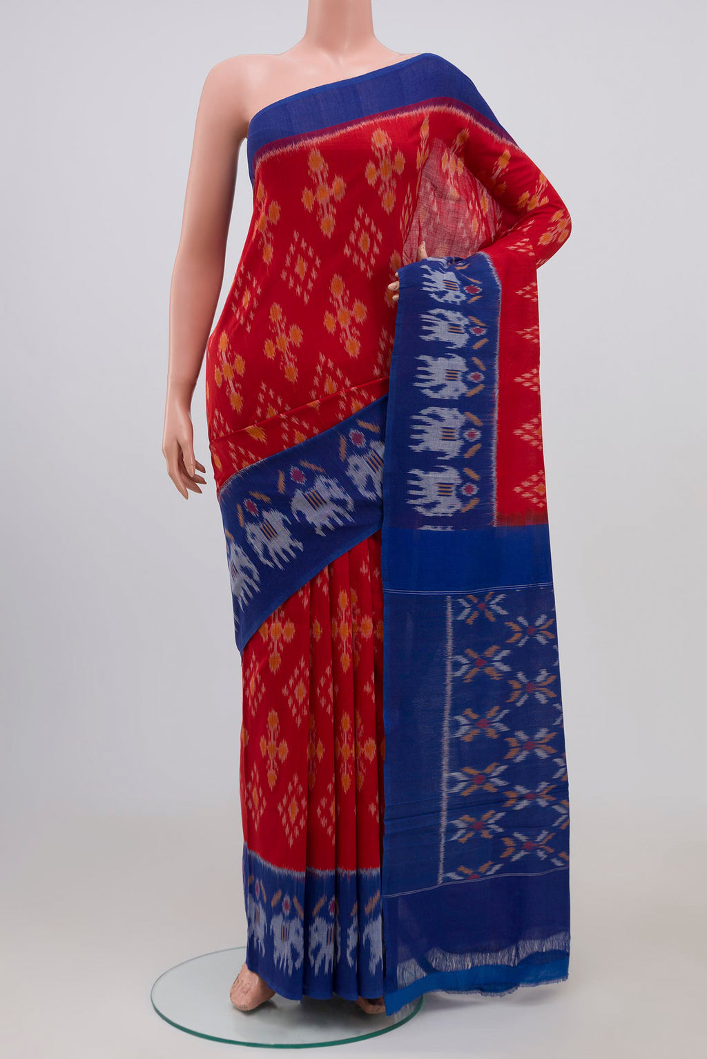 Red Pochampally Cotton Saree with Ikat design on the body and Ikat Border.  displayed on a mannequin