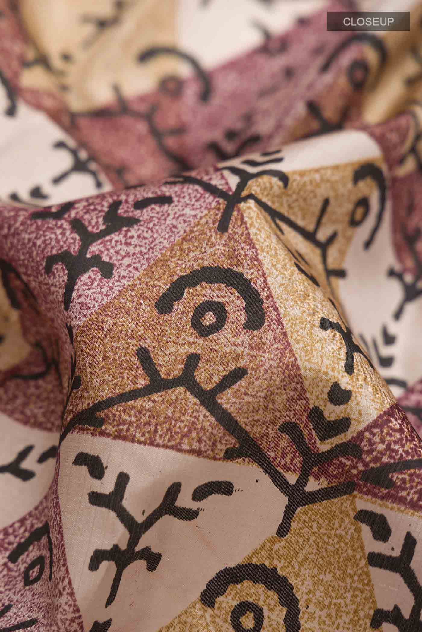 Close up of Mauve Printed Silk Saree with Printed design on the body and Plain Border displaying folds