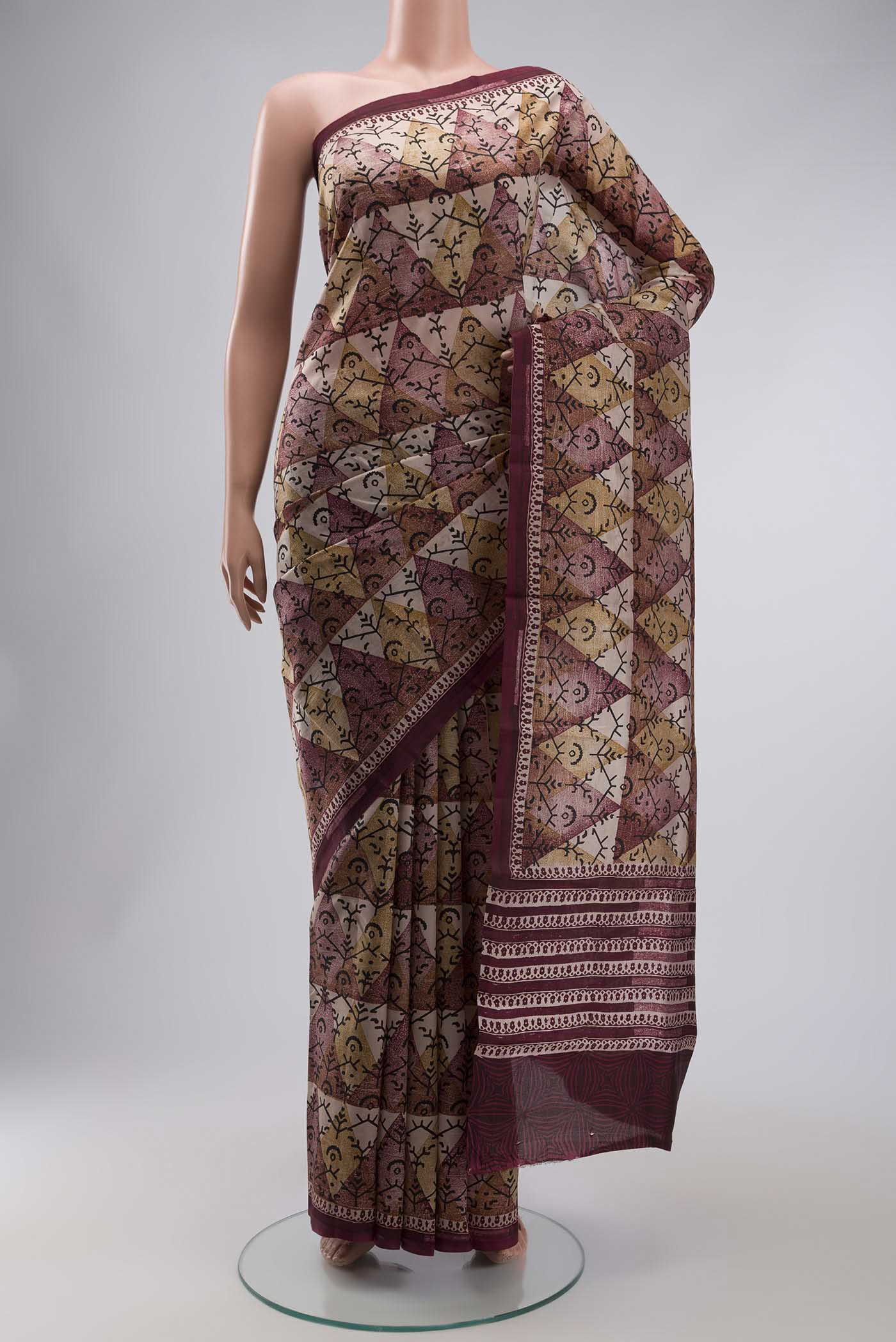 Mauve Printed Silk Saree with Printed design on the body and Plain Border displayed on a mannequin