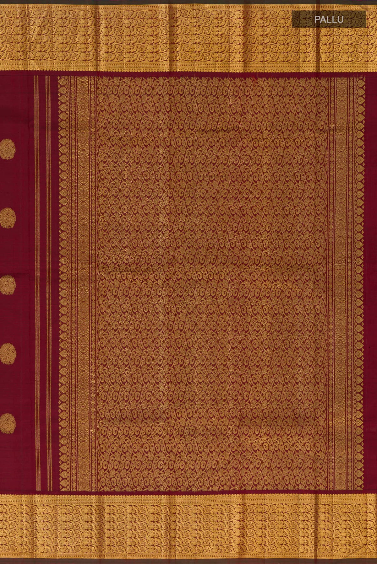 Close up image of the pallu of Pure Silk Pure Zari Maroon Kanchipuram Saree with Zari Butta on the body and Zari Border. 