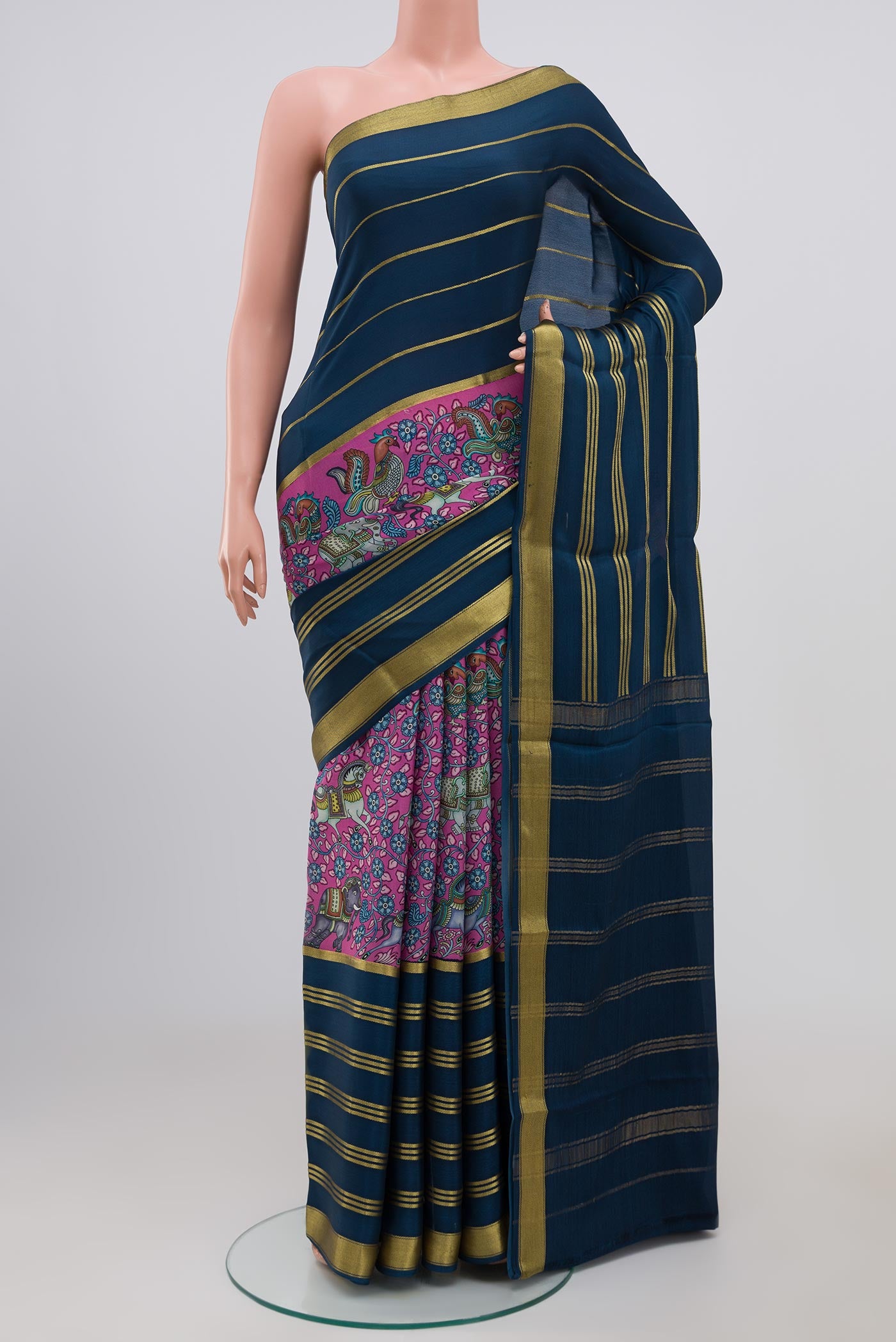 Pink Crepe Saree with Printed design on the body and Zari Border.  displayed on a mannequin