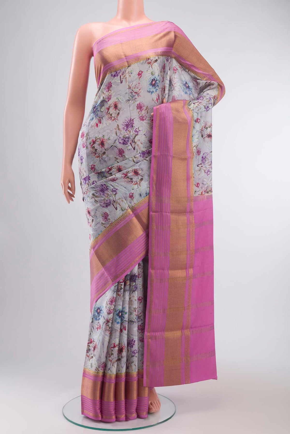 Grey Mysore Crepe Saree with Floral Print on the body and Zari Border displayed on a mannequin