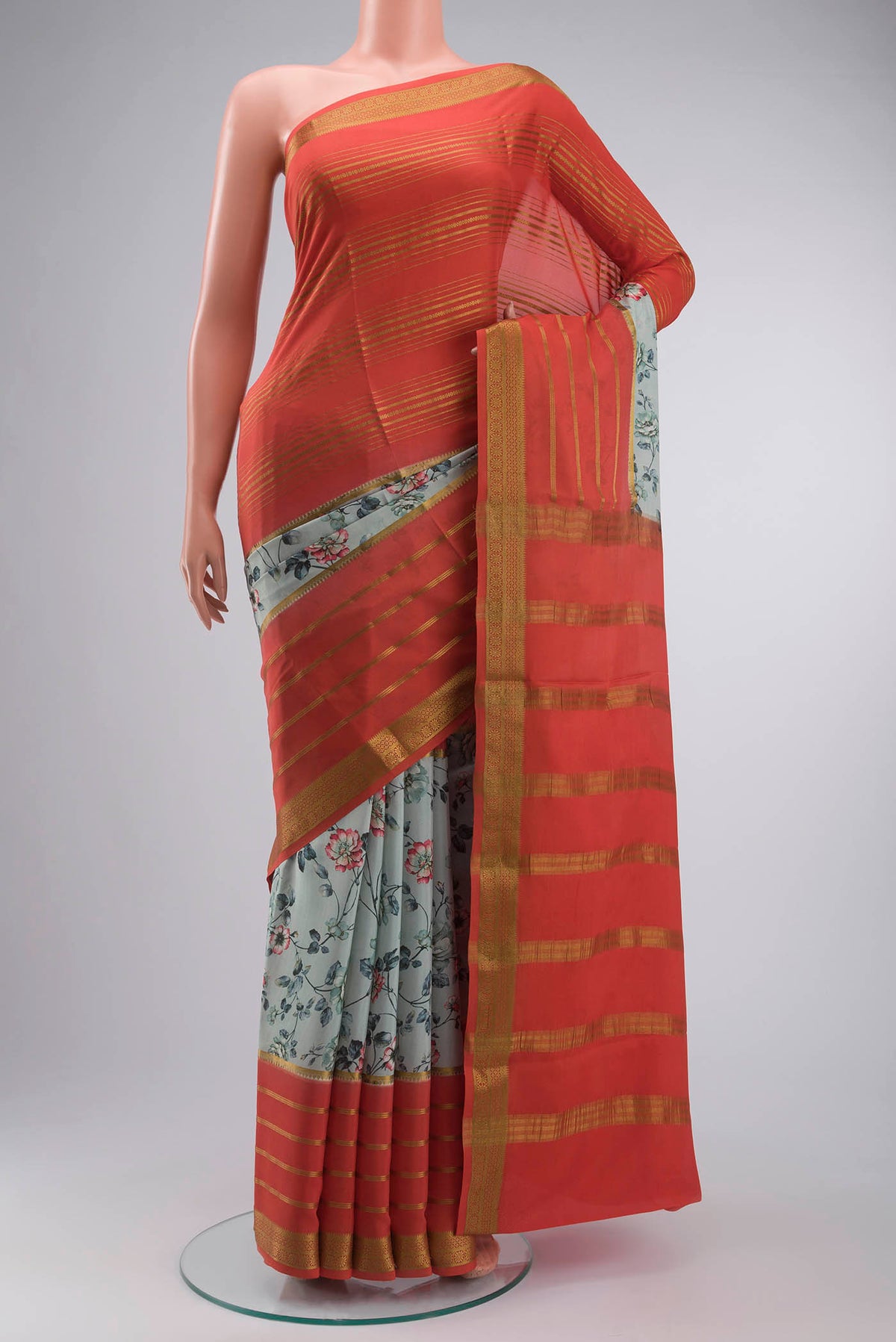 Green Mysore Crepe Saree with Printed design on the body and Zari Border displayed on a mannequin