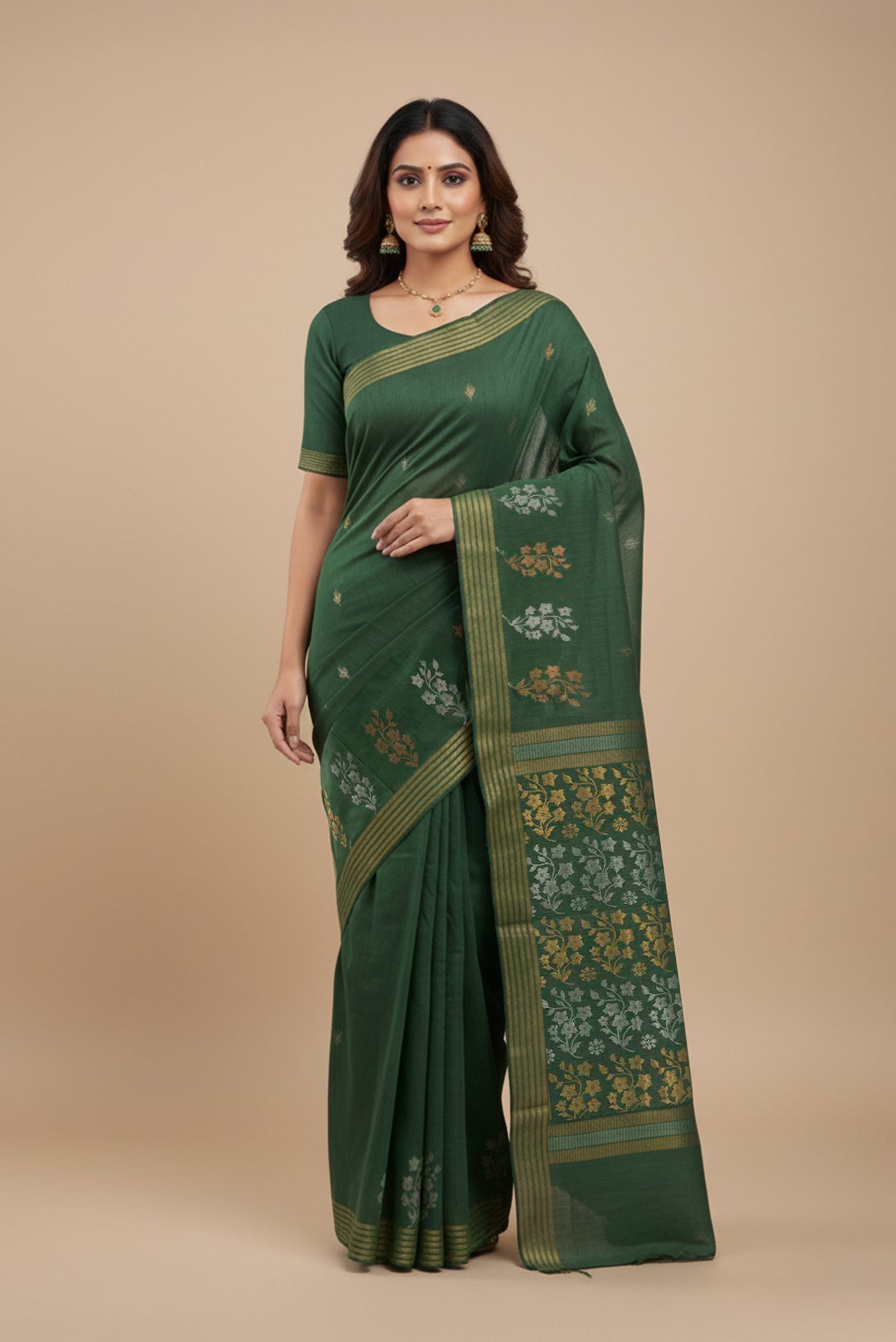 Model wearing a Sage Green Tussar Silk Saree with Zari Butta on the body and Zari Border