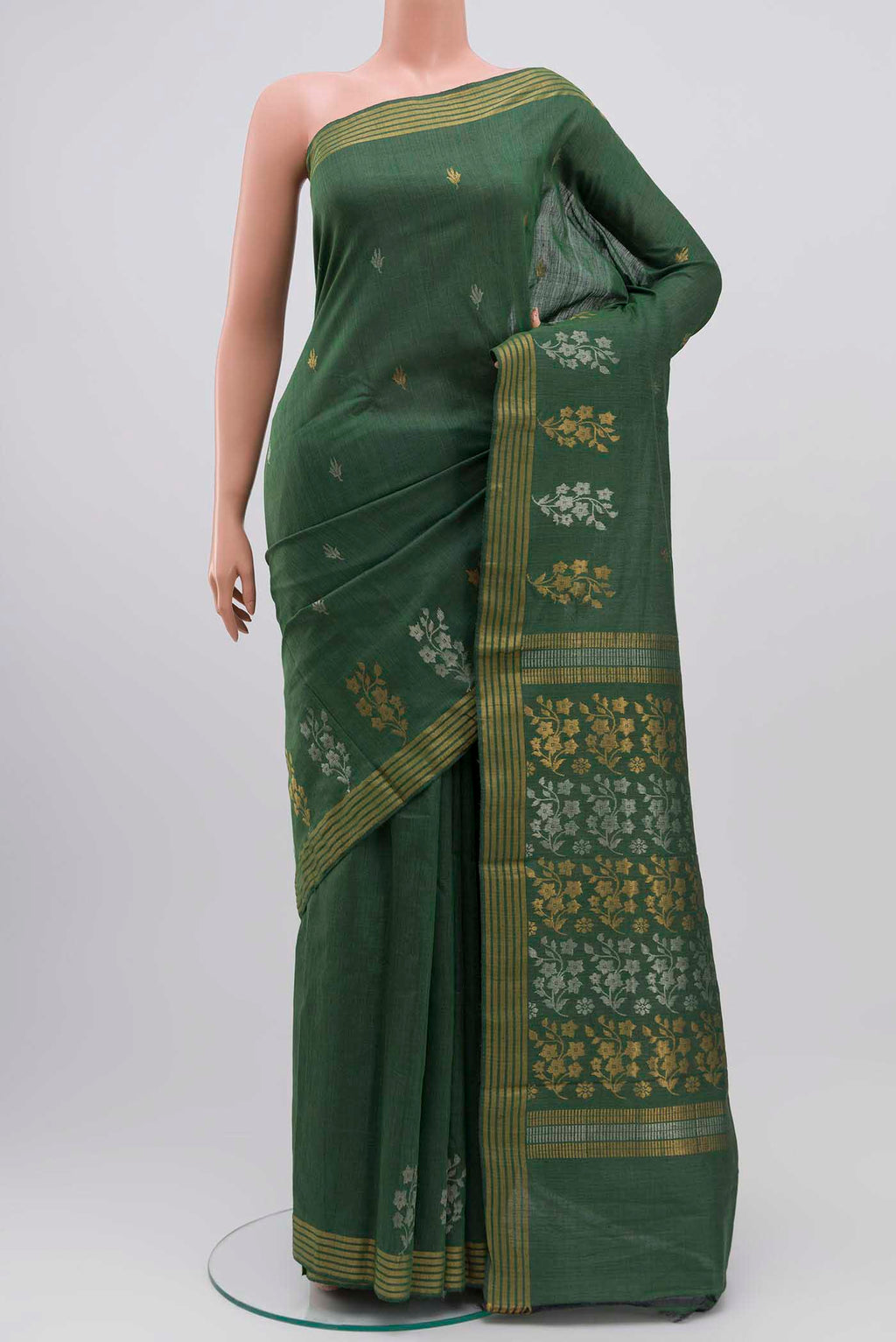 Sage Green Tussar Silk Saree with Zari Butta on the body and Zari Border displayed on a mannequin